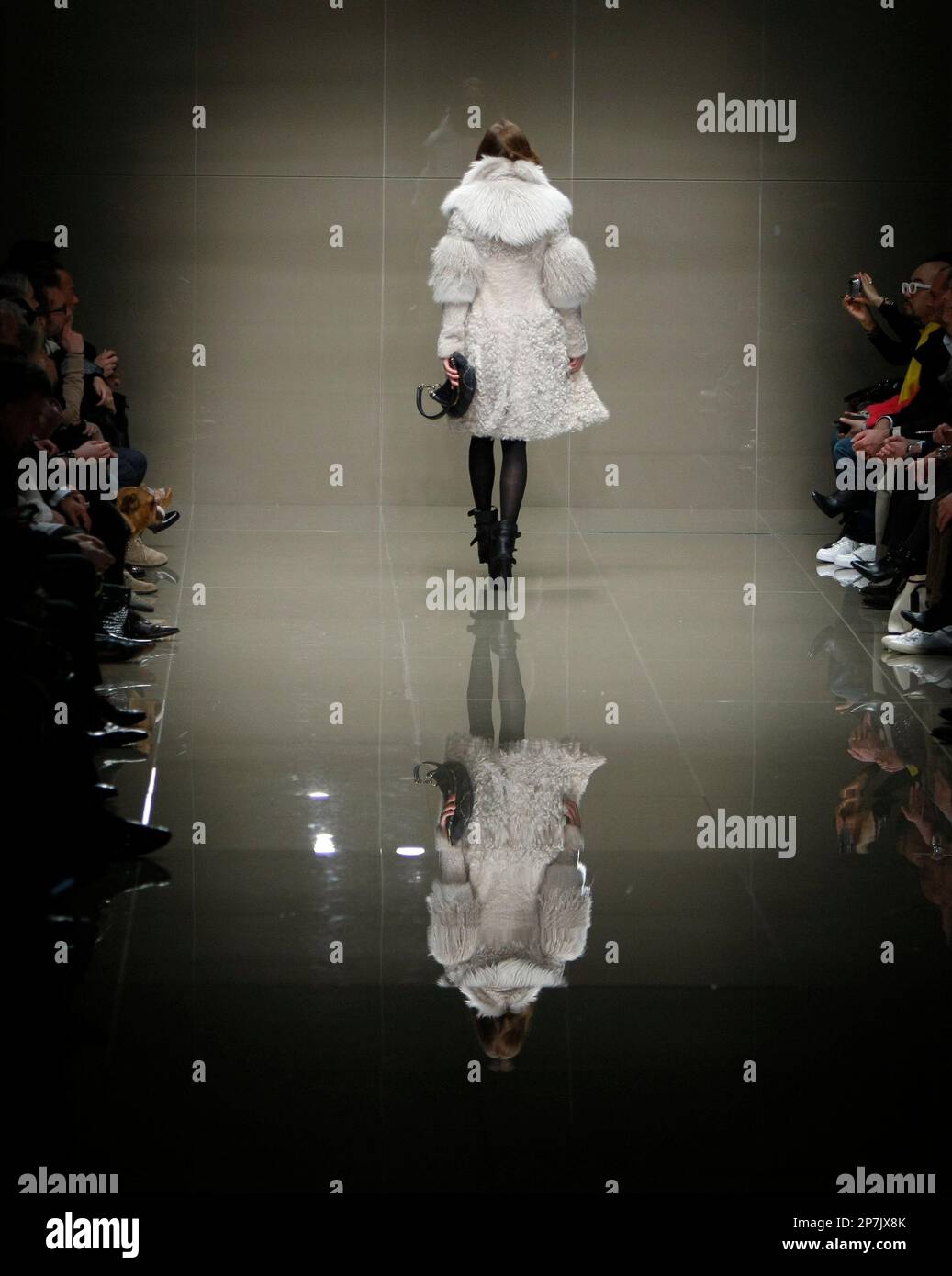 A model wears an outfit by designers Burberry Prorsum for their