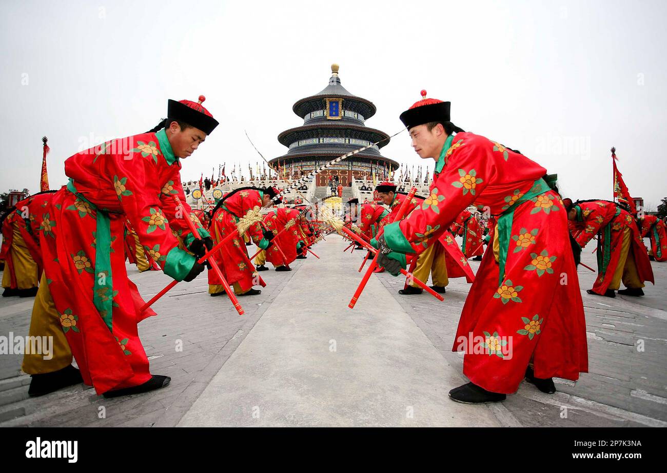 Artists dressed in Qing Dynasty costumes take part in a performance to ...