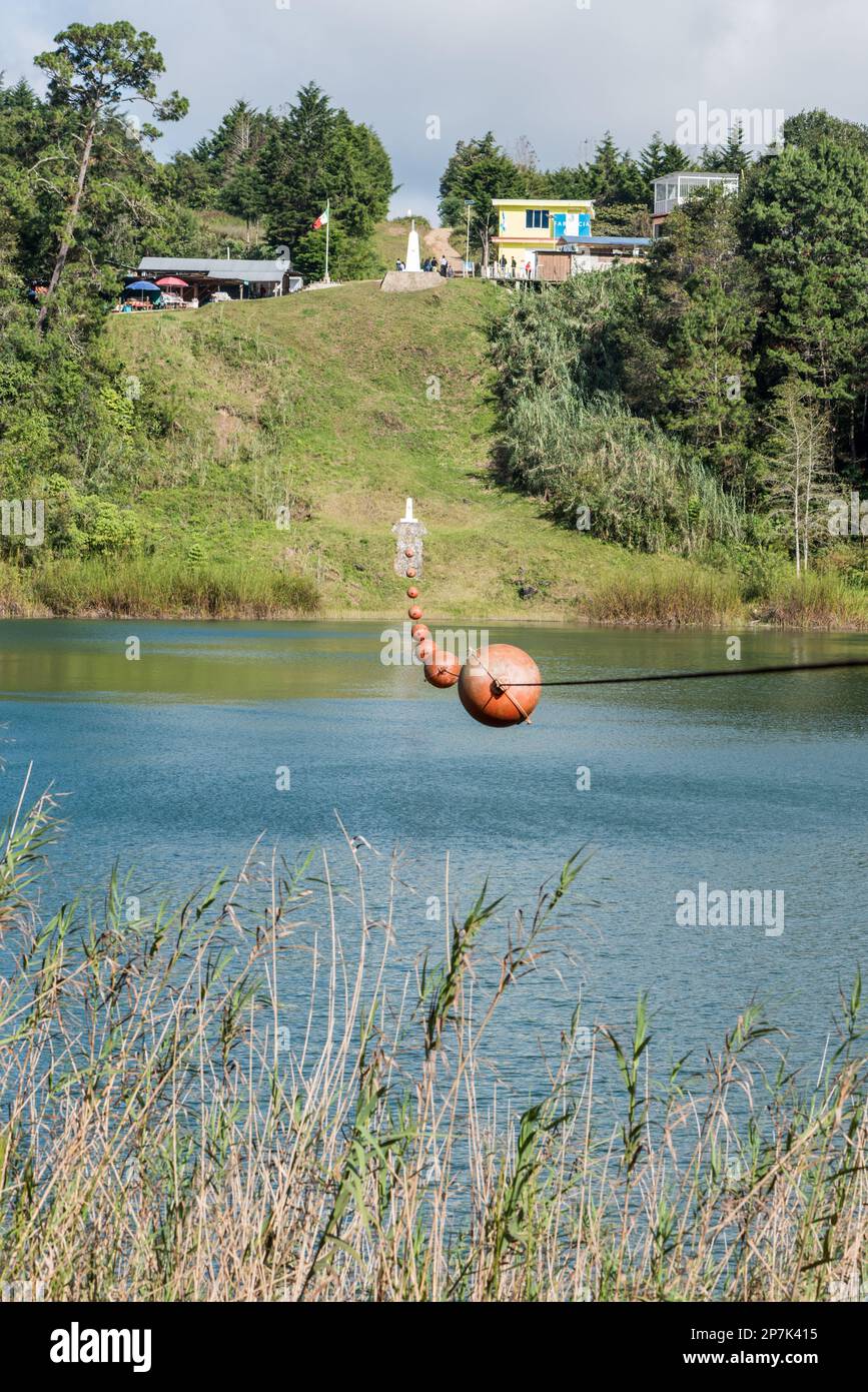 Rope with buoys over a lagoon marking the border between Mexico and