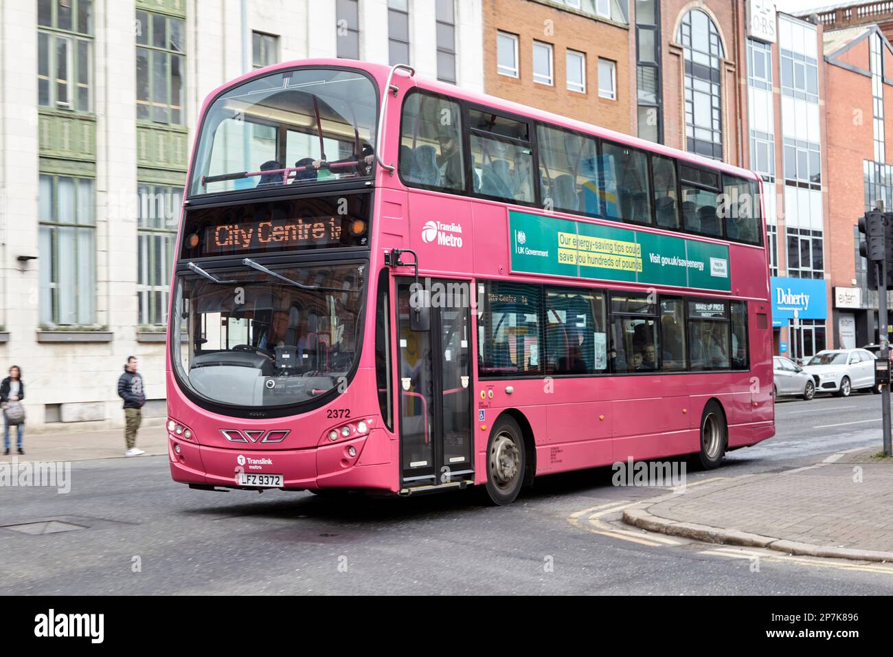 pink metro translink belfast city bus public transport company Belfast Northern Ireland UK Stock Photo