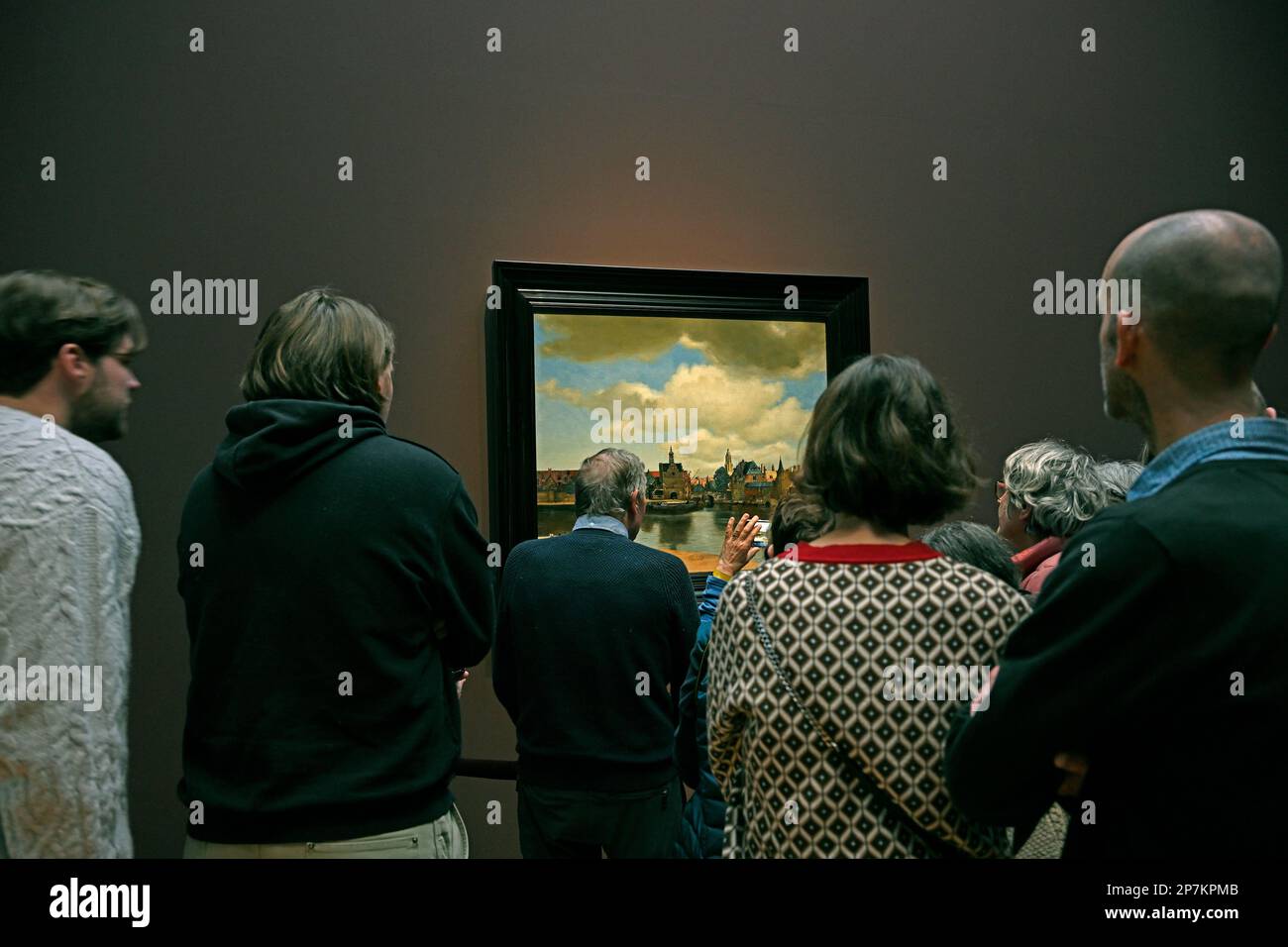 amsterdam, netherlands - 2023-03-06: rijksmuseum - 2023 jan vermeer exhibition - people admiring vermeers painting view of delft  ---   [credit: joach Stock Photo
