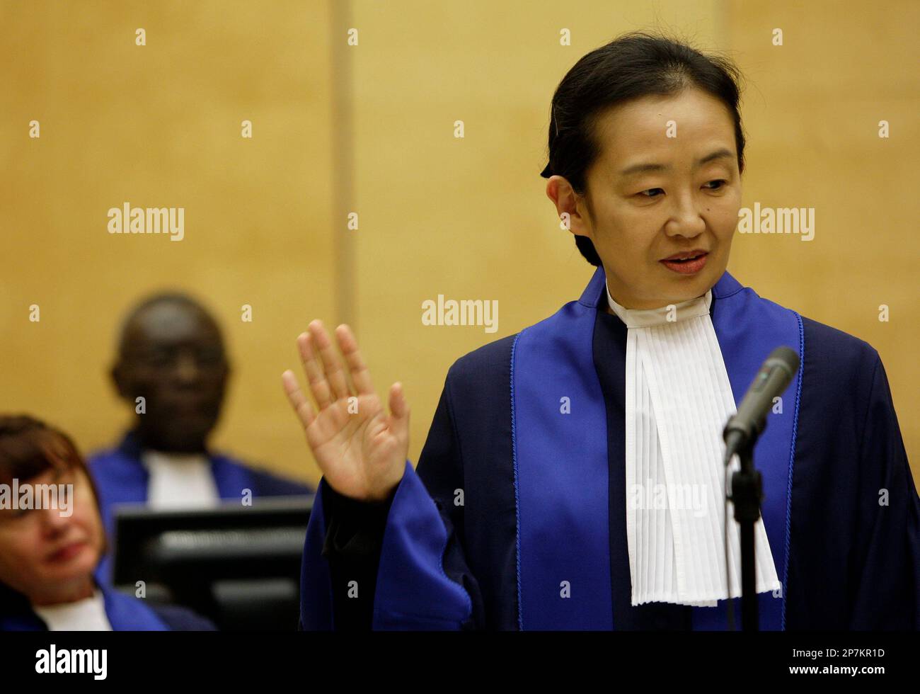 Kuniko Ozaki from Japan takes the oath during a swearing-in ceremony as ...