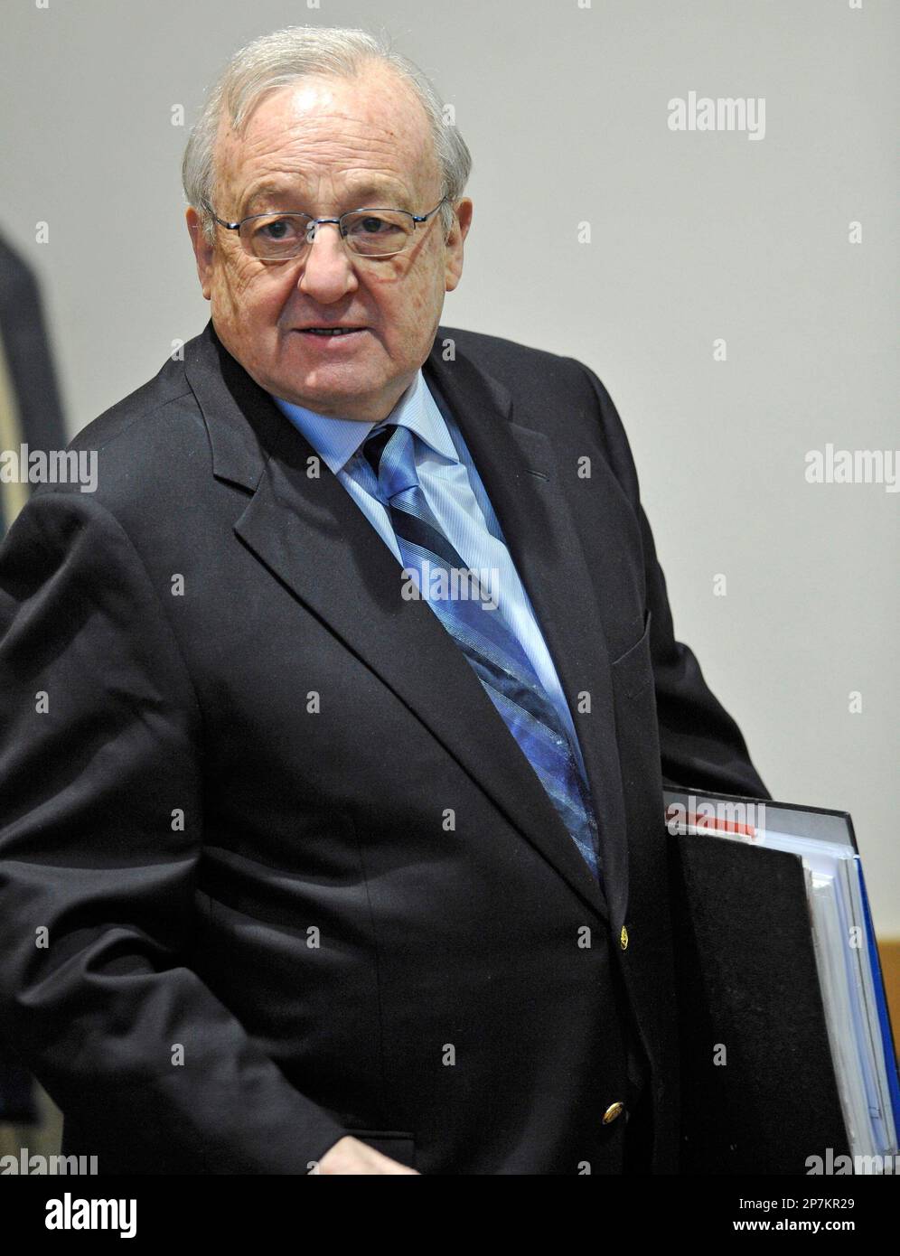 German businessman Karlheinz Schreiber enters a courtroom in Augsburg
