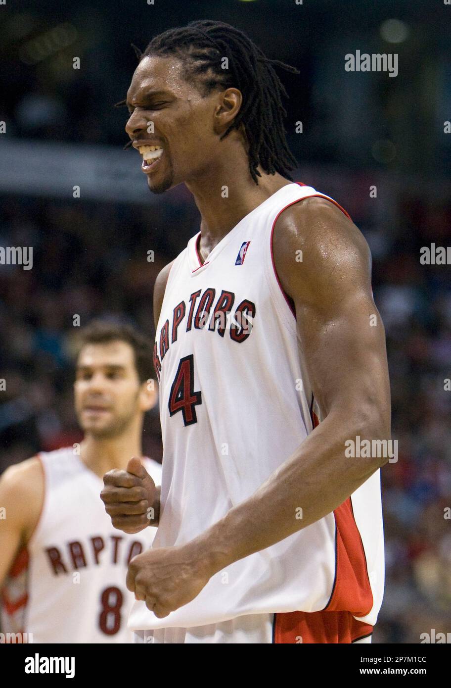 Toronto Raptors forward Chris Bosh (4) reacts after being called for a ...