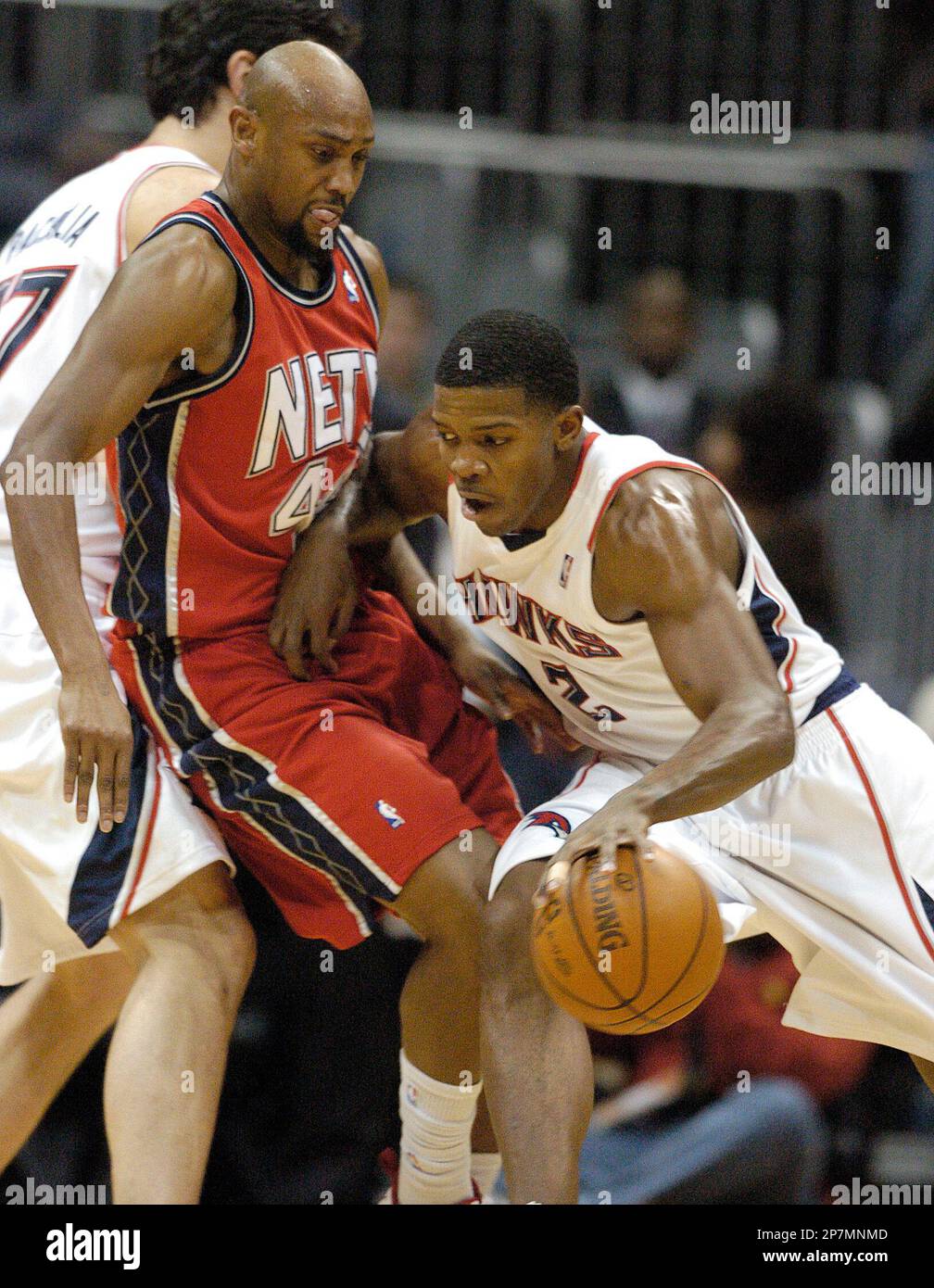 Atlanta Hawks guard Joe Johnson right drives into New Jersey