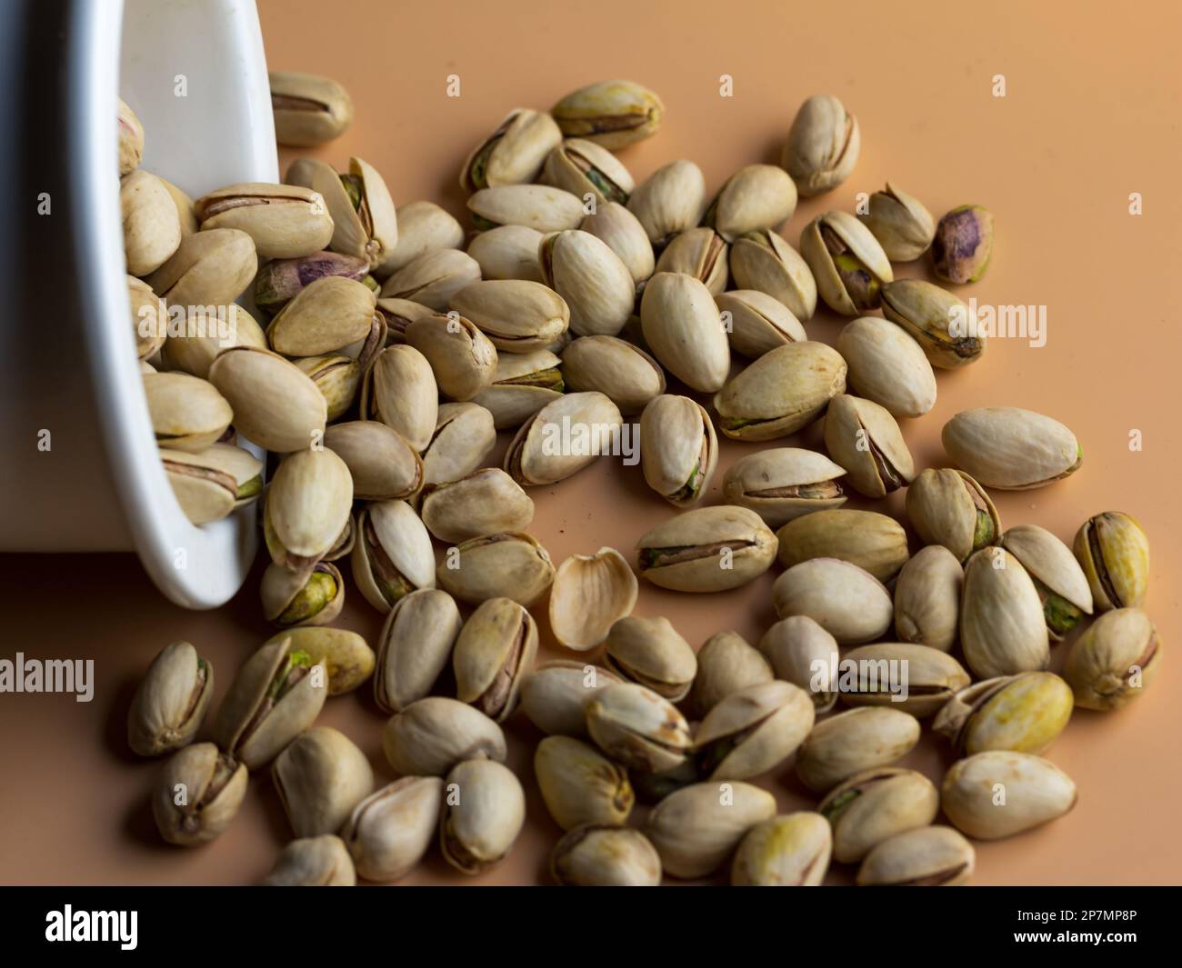pistachio nuts in shell in a cream color background Stock Photo Alamy