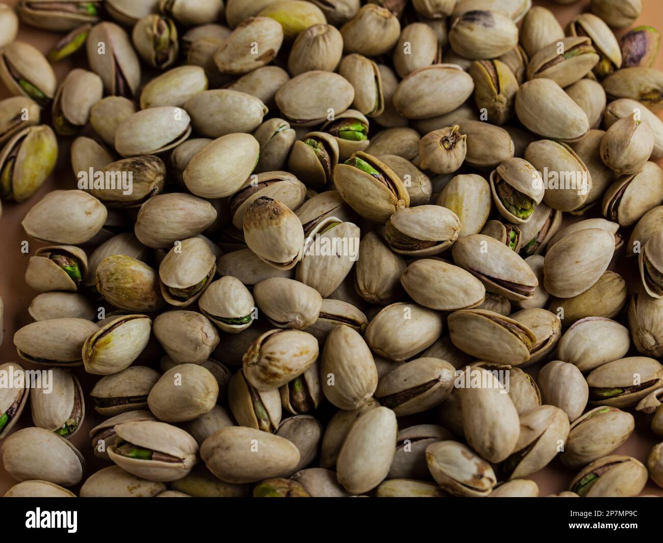 pistachio nuts in shell in a cream color background Stock Photo Alamy