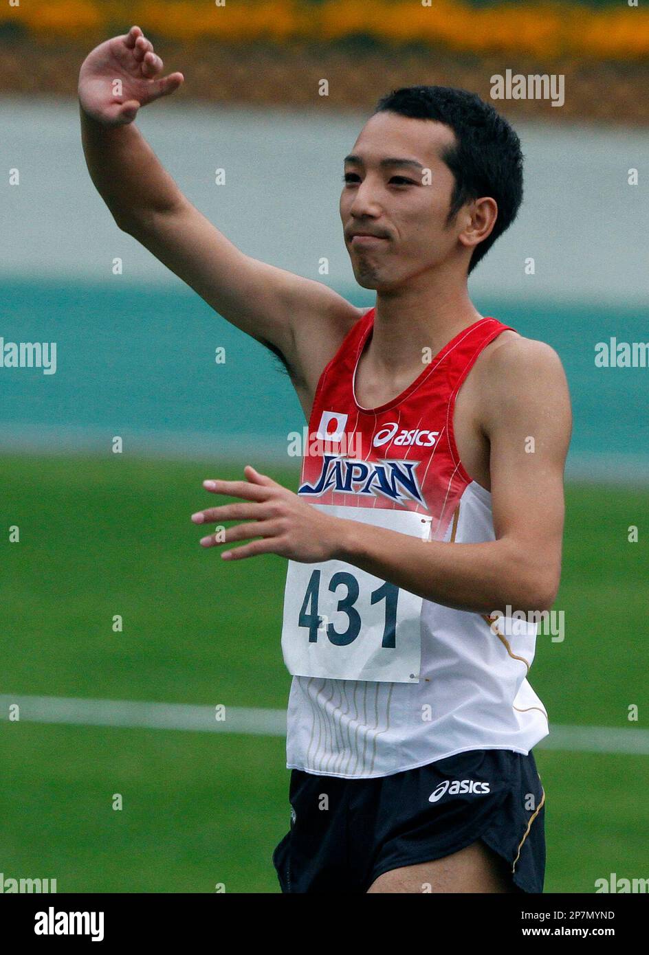Hikaru Tsuchiya of Japan reacts in the men's high jump final in the Hong  Kong East Asian Games Saturday, Dec. 12, 2009. Tsuchiya won a gold medal.  (AP Photo/Vincent Yu Stock Photo -