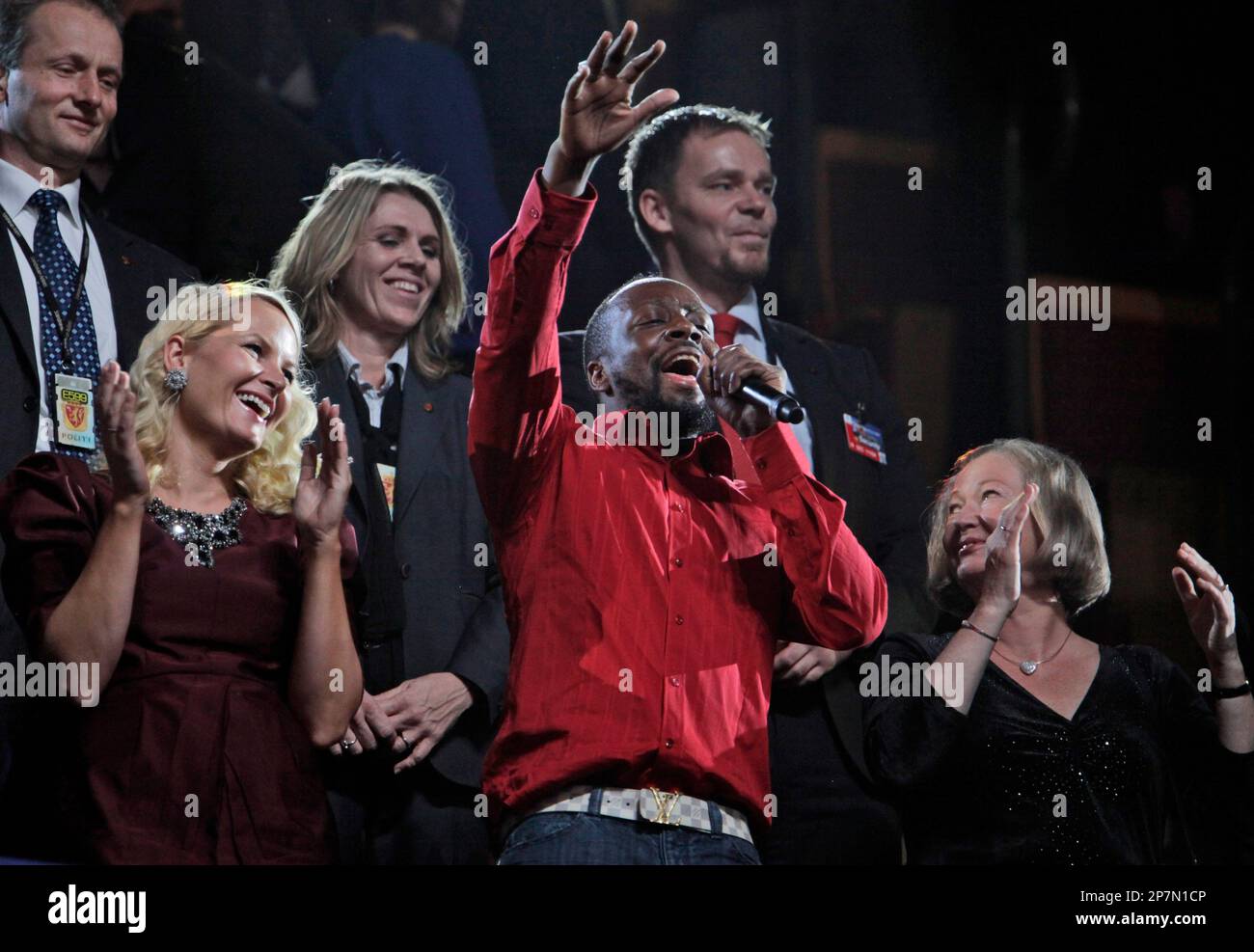 Haitian singer Wyclef Jean, centre dances with Norwegian Crown Princess  Mette Marit, left and Nobel Committeee member Kaci Kullman Five , right, in  the Royal box during the Nobel Peace Prize concert