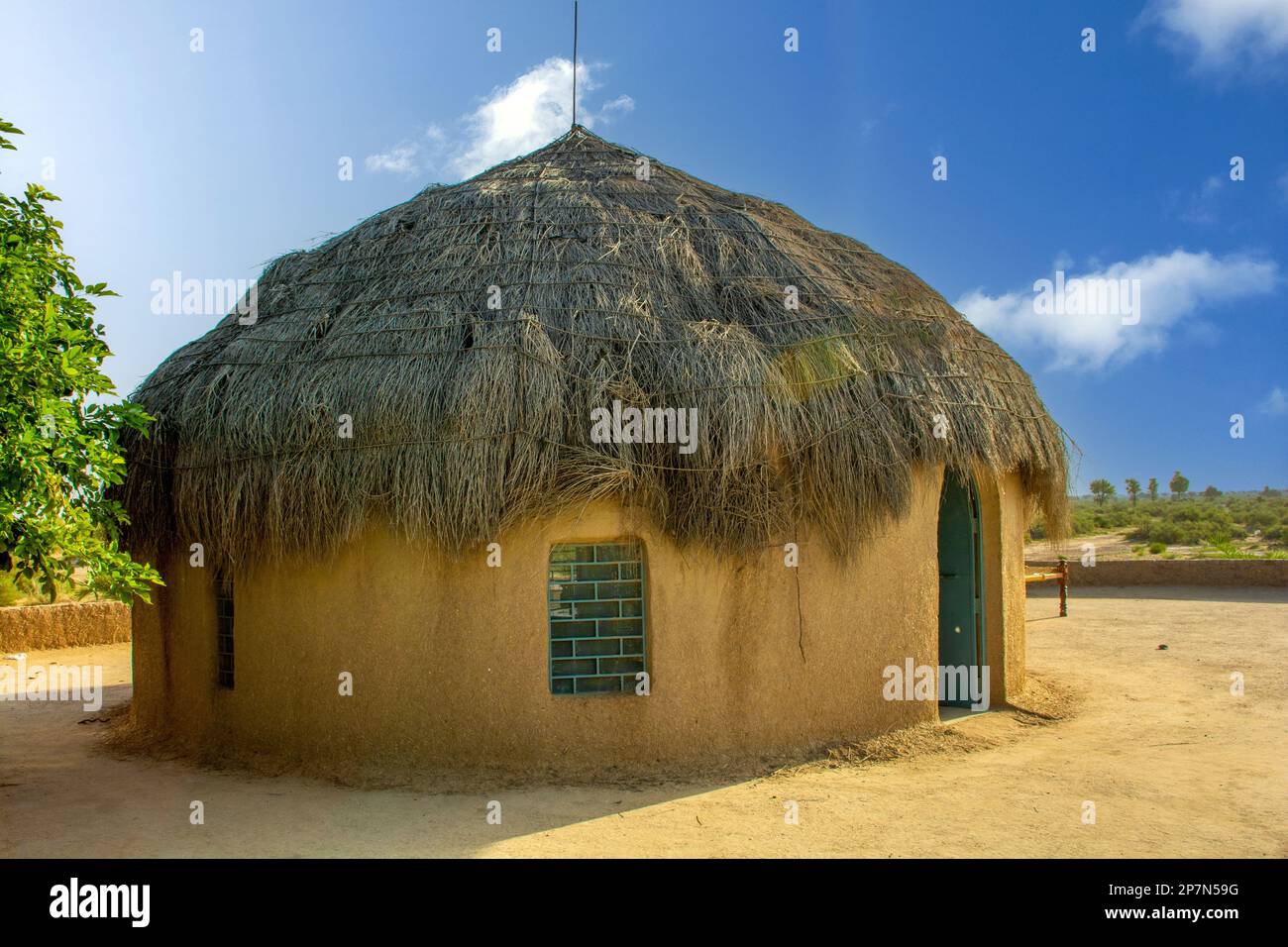 Traditional mud hut house in the Thar desert near the India Pakistan border Stock Photo