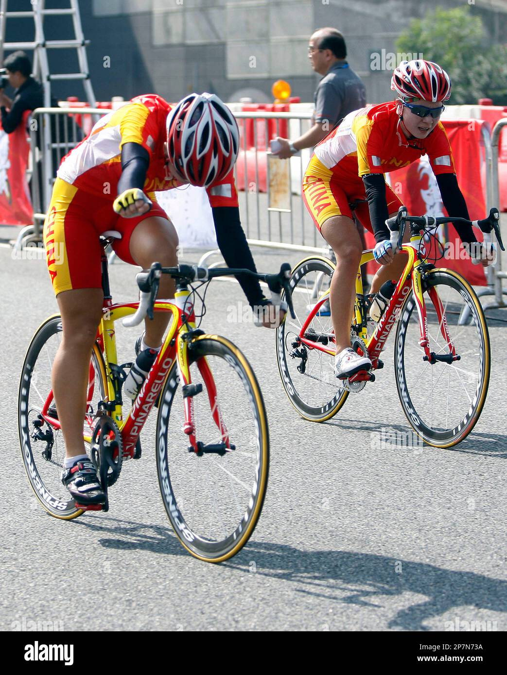 Liu Xiaohui of China, left, celebrates after crossing the finishing ...