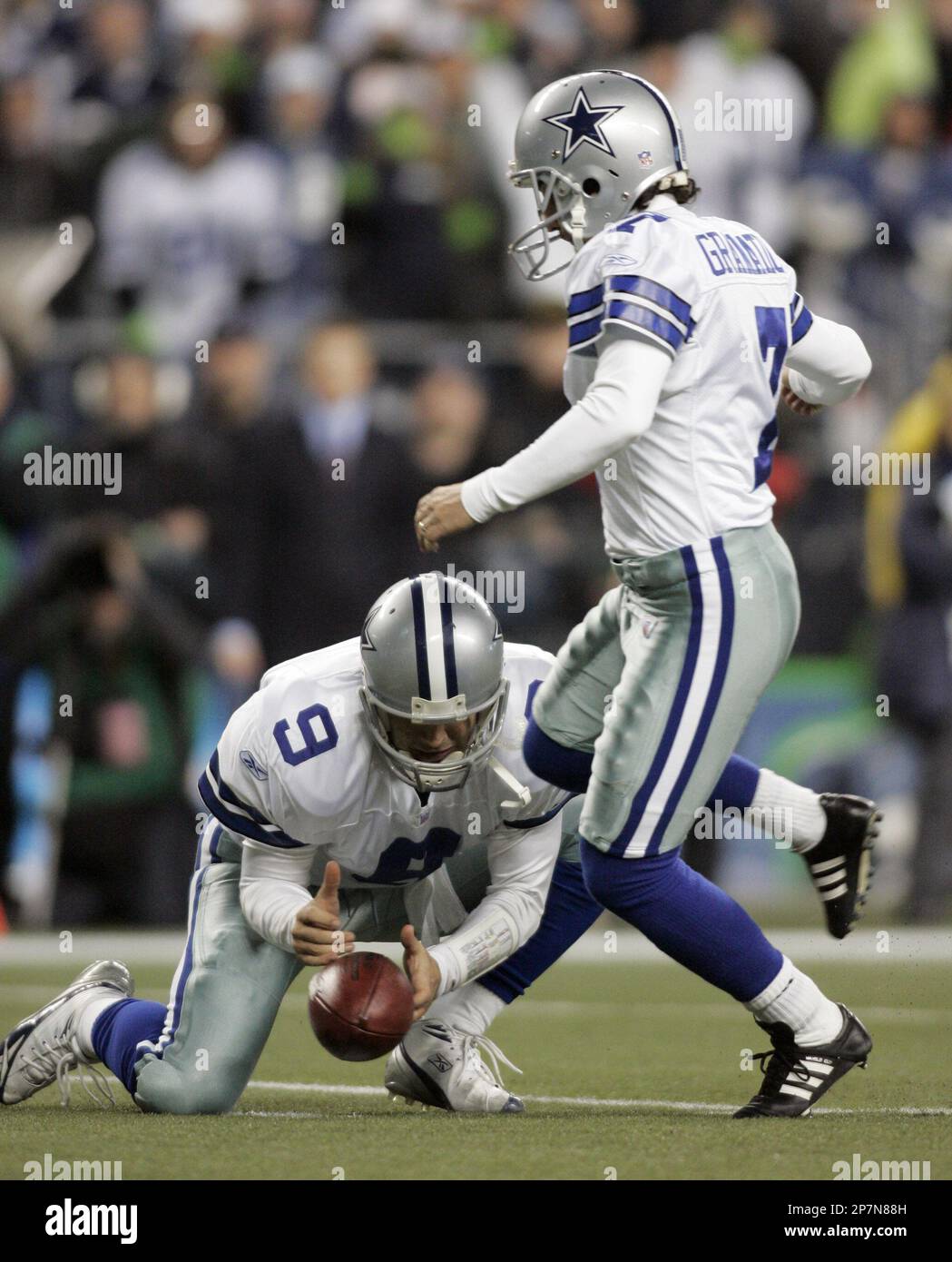 Dallas Cowboys holder Tony Romo (right) can't get the ball placed for  kicker Martin Gramatica to attempt a field goal against the Seattle  Seahawks late in the fourth quarter of NFC Wild-Card