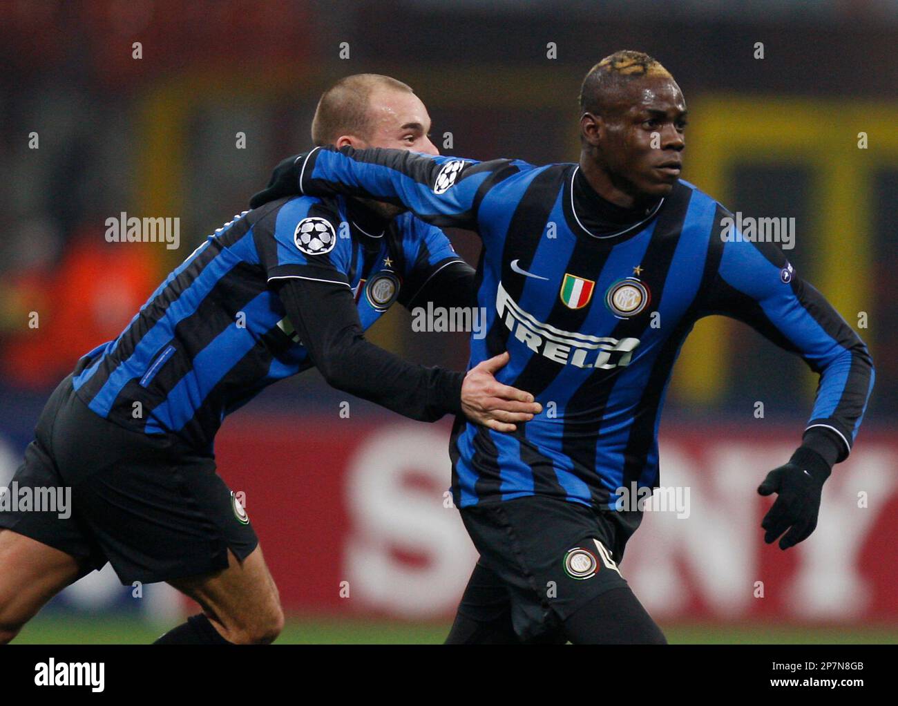 Inter Milan's Mario Balotelli, right, celebrates after scoring with  teammate Wesley Sneijder of the Netherlands, during a Group F, Champions  League match between Inter Milan and Rubin Kazan, at the San Siro