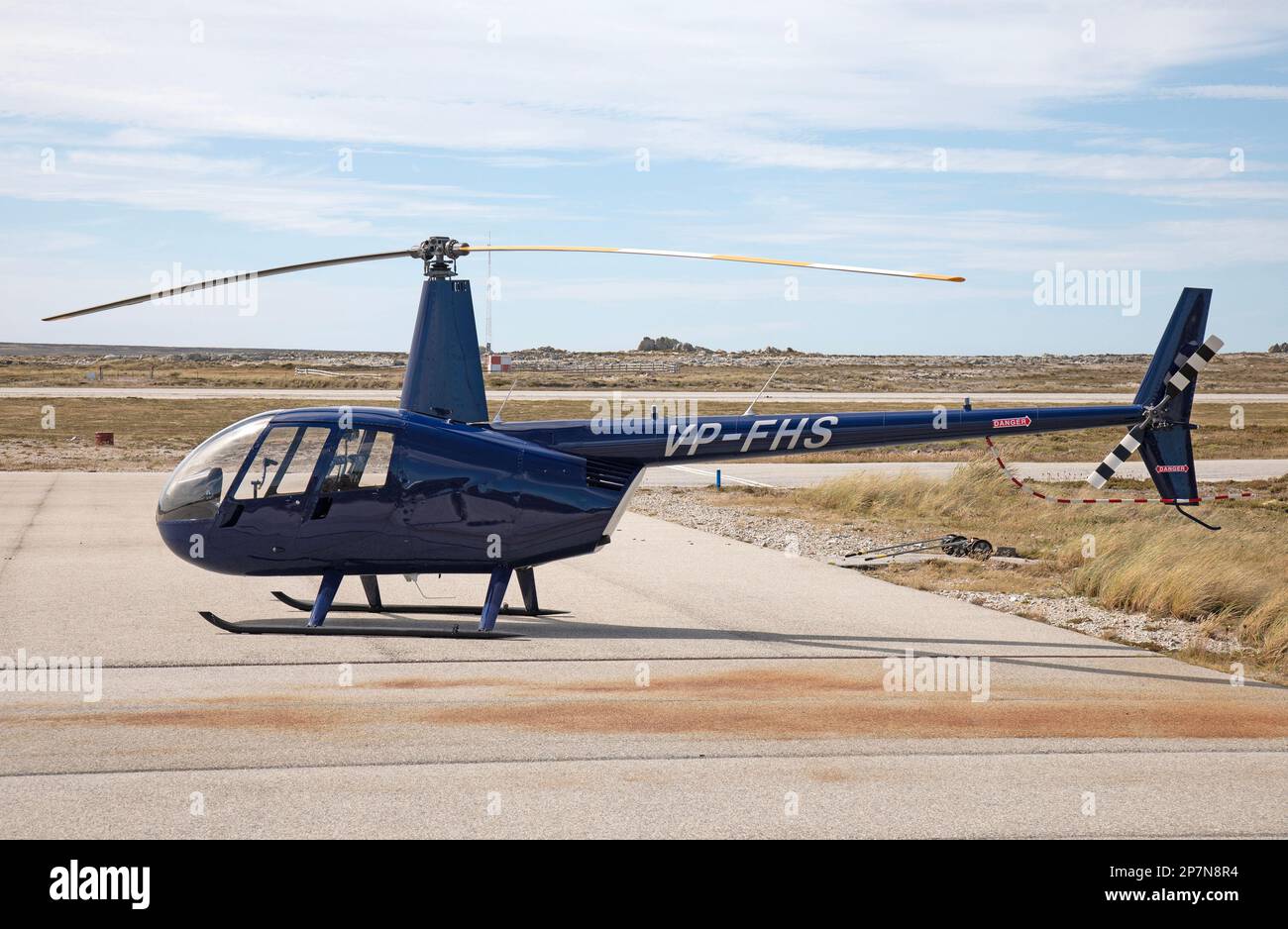 A Robinson R-44 Raven II helicopter, registration number VP-FHS,at Stanley Airport in The Falkland Islands. Stock Photo