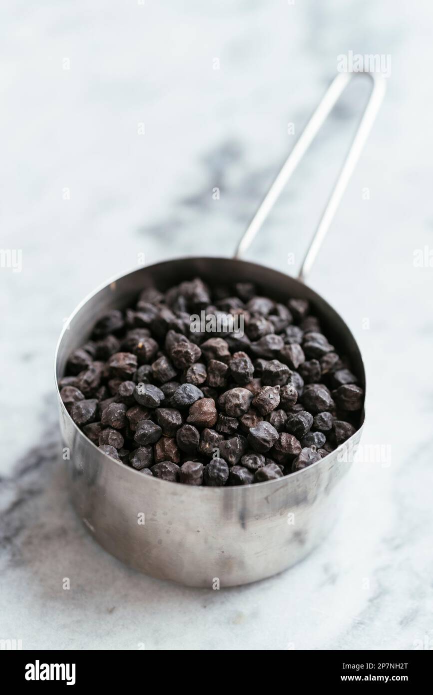 One cup of black chickpeas (ceci neri), a special chickpea variety from Italy. Stock Photo