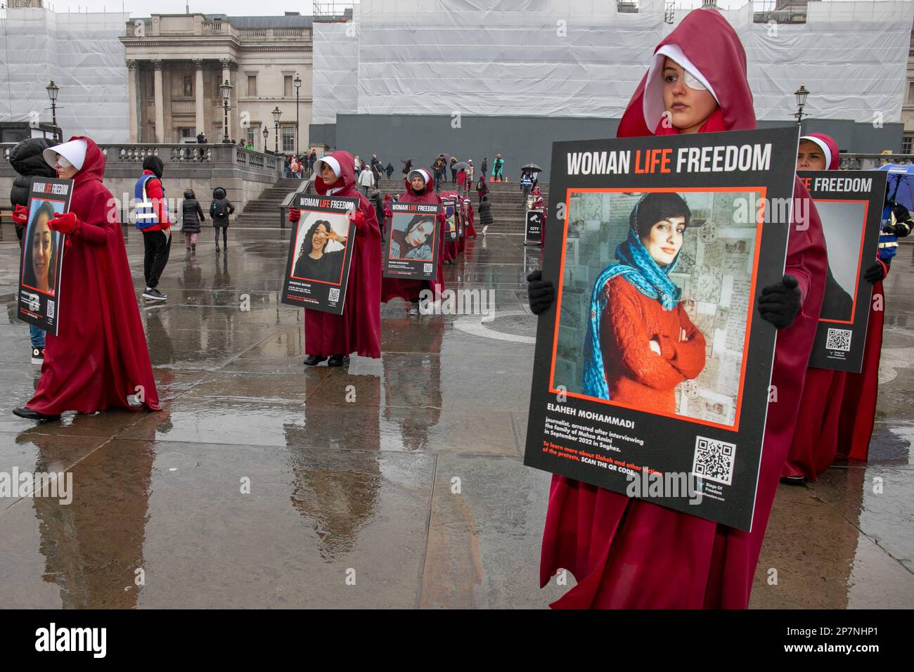 London, England, UK 08/03/2023 British Iranian women dress as handmaids from The Handmaids Tale in solidarity with women in Iran. Credit: Denise Laura Baker/Alamy Live News Stock Photo