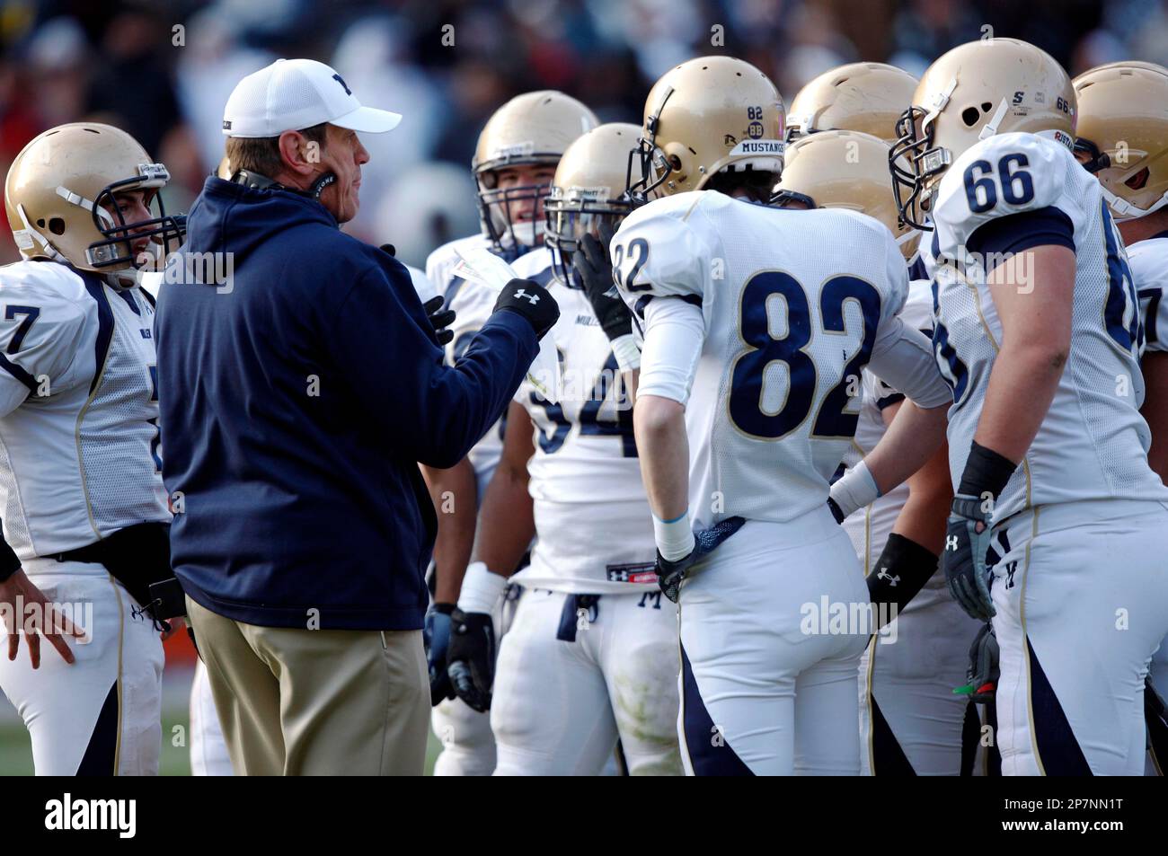 Mullen head coach Dave Logan, second form left, talks with his players,  from left to right, quarterback Jonny Miller, running back Adonis  Ameen-Moore, tight end Kevin Brady and offensive lineman Michael Mancinelli