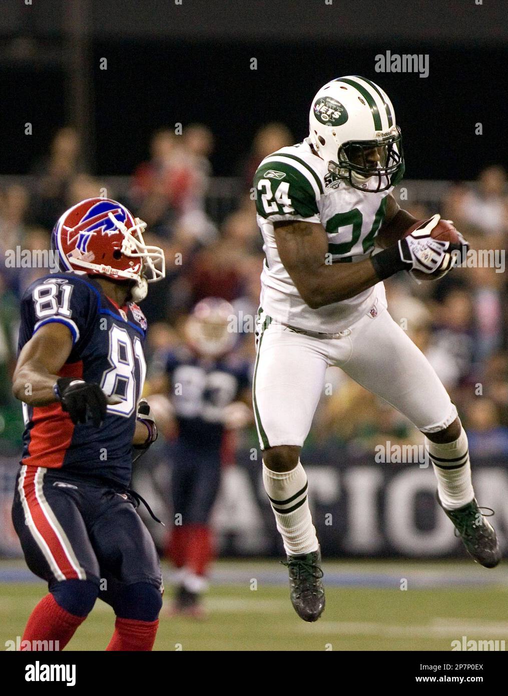New York Jets corner back Darrelle Revis, right, intercepts a pass in ...