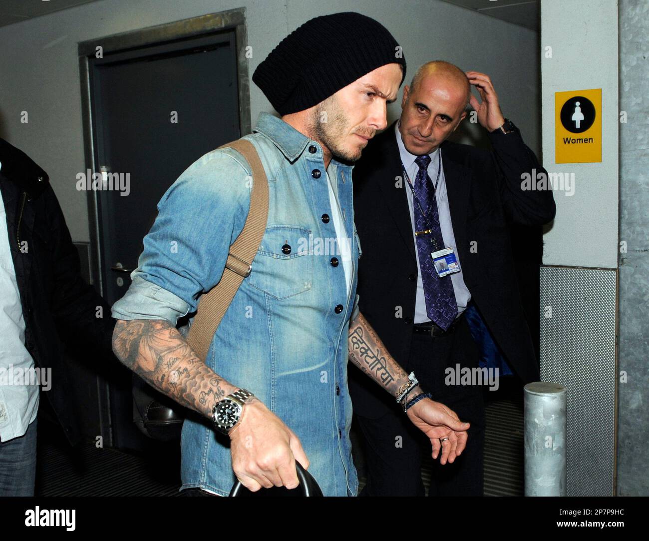 David Beckham, carrying his Louis Vuitton travel bag, gets a police escort  as he arrives at LAX airport on a British Airways Stock Photo - Alamy