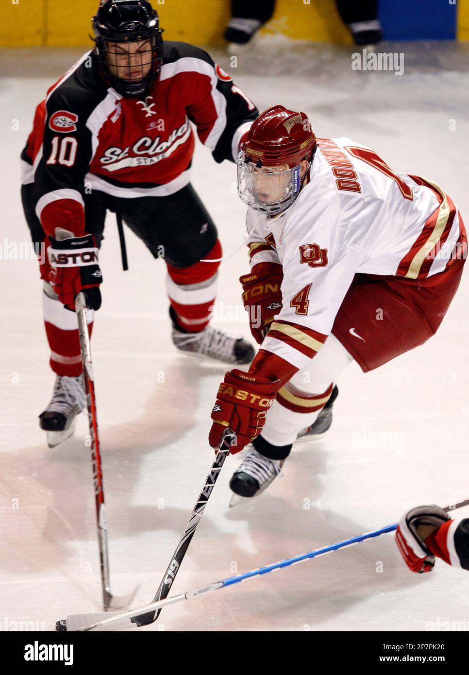 Denver's Matt Donovan (4) skates against St. Cloud State's Ben Hanowski ...
