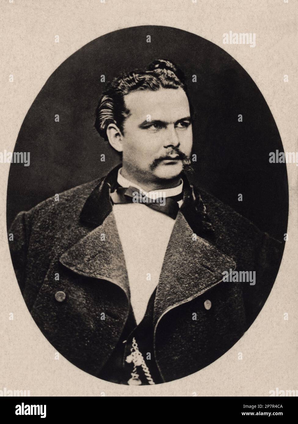 1875 ca , Bavaria , GERMANY  : A portrait of younk King von Bayer LUDWIG II ( Louis ) of Wittelsbach  , King of Bavaria , known as ' Mad King Ludwig '  ( 1845 – 1886 ).  King of Bavaria from 1864 until his death. -  RE - REALI - ROYALTY - nobili - nobiltà - BAVIERA - music - classical - musica classica - portrait - ritratto - GAY - homosexual - homosexuality - omosessuale - omosessualità - LGBT - suicida - suicidio - german nobility  - NOBILITY - NOBILI - NOBILTA' - REALI - ROYALTY  - BAVIERA - GERMANIA  - cravatta - papillon - tie bow - collar - colletto - baffi - moustache - coat - cappotto Stock Photo