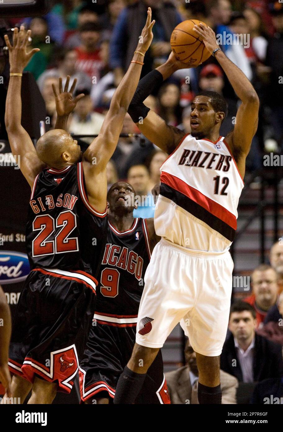 Portland Trail Blazers forward LaMarcus Aldridge, right, looks to pass  against the double-team defense of Chicago Bulls' Taj Gibson, left, and  Luol Deng during the first half of their NBA basketball game