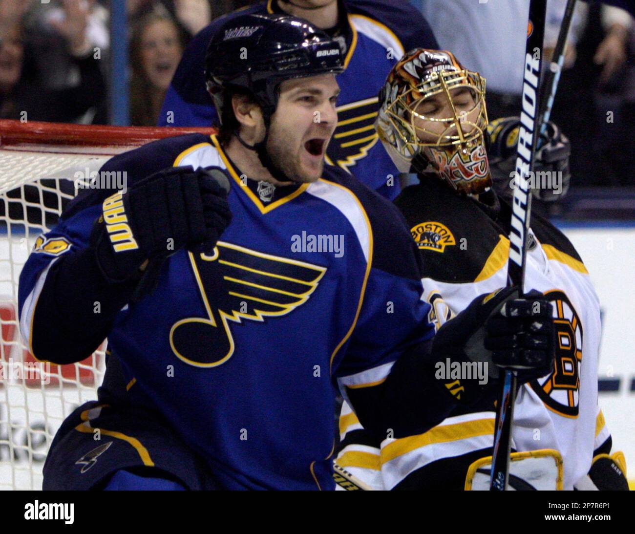 St. Louis Blues' Carlo Colaiacovo, left, celebrates after scoring past ...