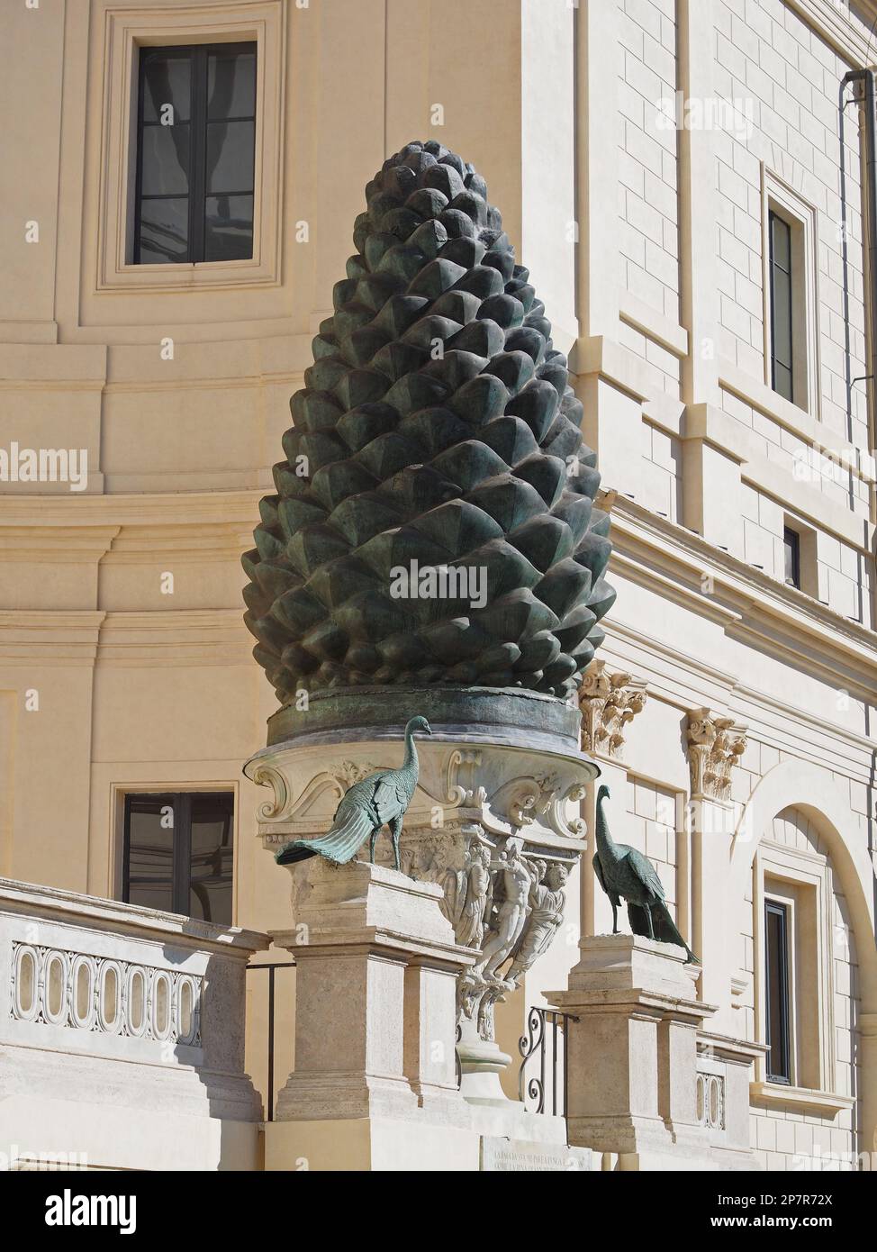 Fontana della Pigna is a 4m high Roman bronze pinecone that once spouted water from the top. It now occupies a vast niche in a wall of the Vatican. Stock Photo