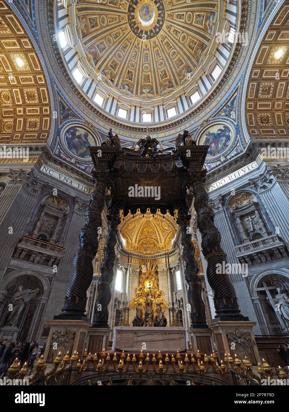 The huge bronze altar in Saint Peters Basilica in the Vatican. It is exactly over the spot where Saint Peter was buried. Stock Photo