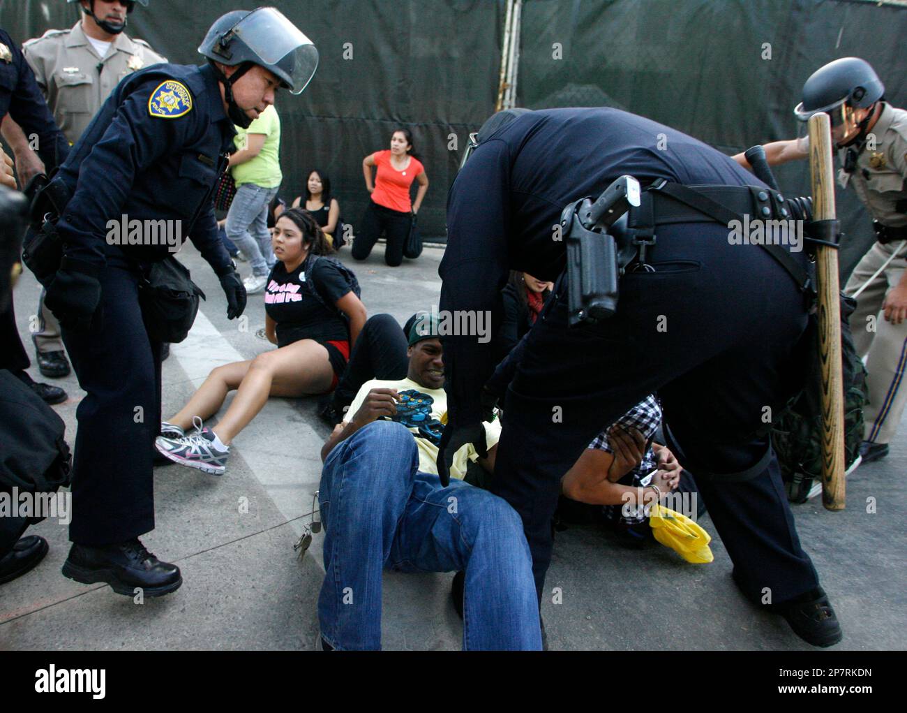Student Rustin O'Neil, center, is stunned with a taser gun as Vianney