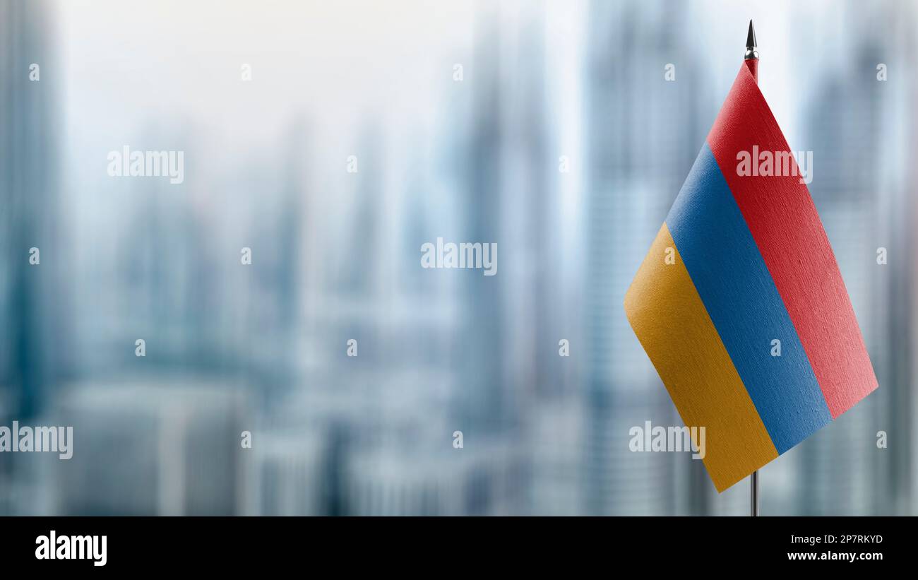 Small flags of the Armenia on an abstract blurry background Stock Photo ...