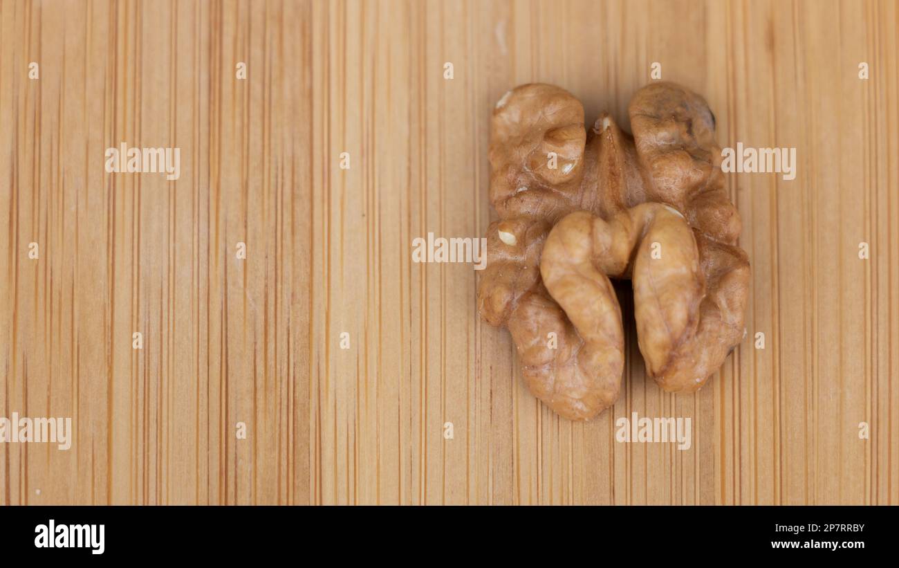 Walnuts on a wooden background. Close-up. Selective focus. Stock Photo