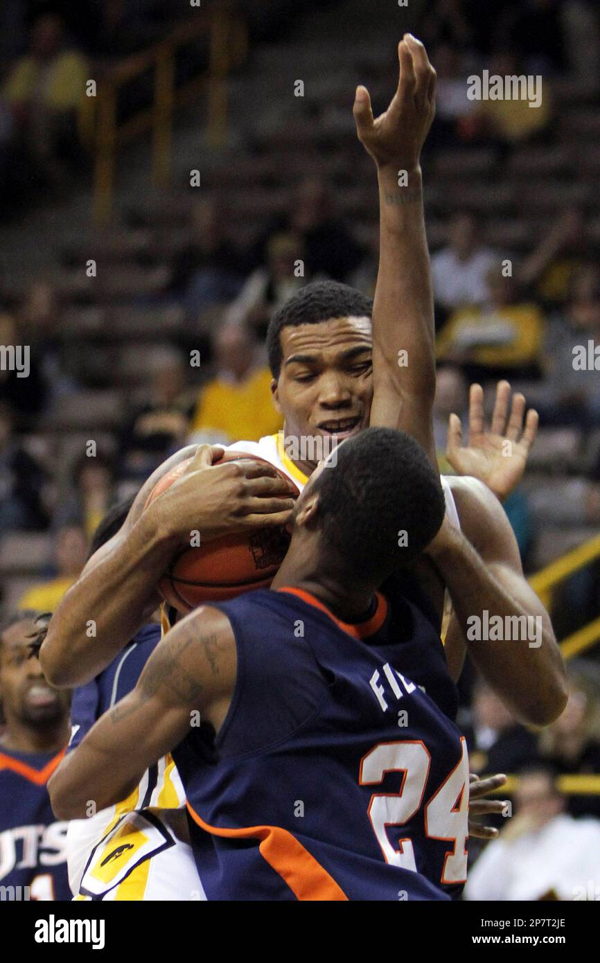 Iowa's Jarryd Cole fights for a loose ball with TexasSan Antonio's