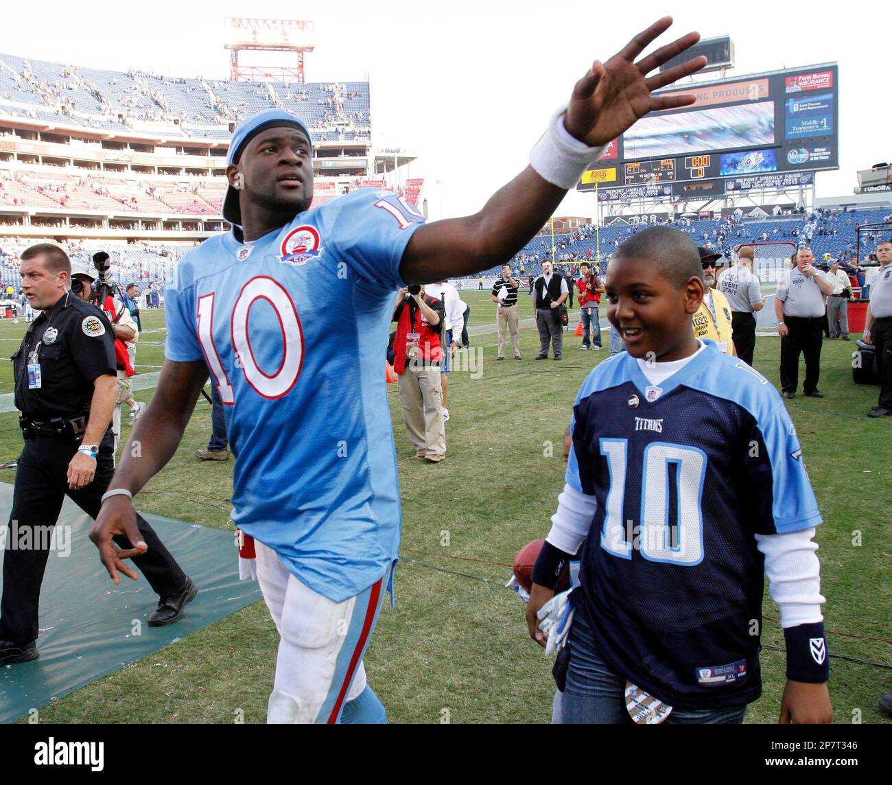 Tennessee Titans quarterback Vince Young waves to fans as he leaves the