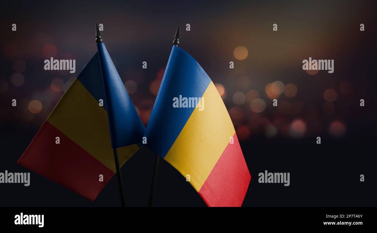 Small flags of the Chad on an abstract blurry background Stock Photo ...