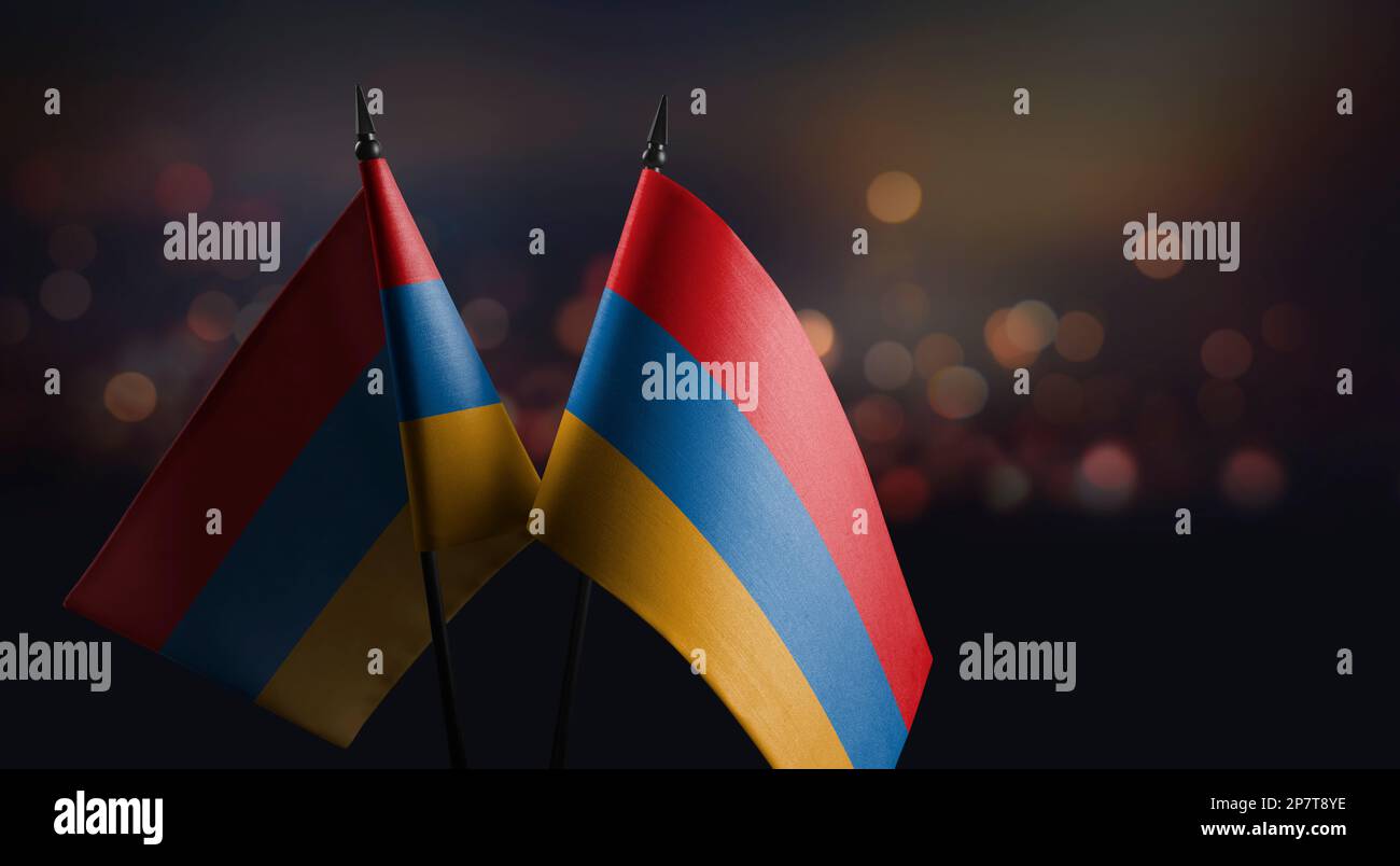 Small flags of the Armenia on an abstract blurry background Stock Photo ...