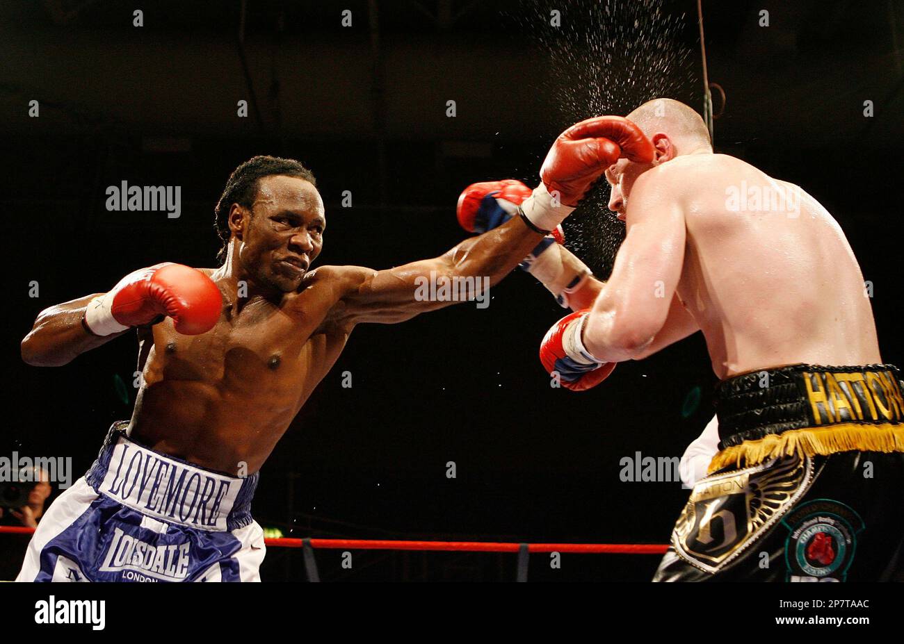 Britain's Matthew Hatton, right, is hit by a punch from Lovemore N'Dou ...