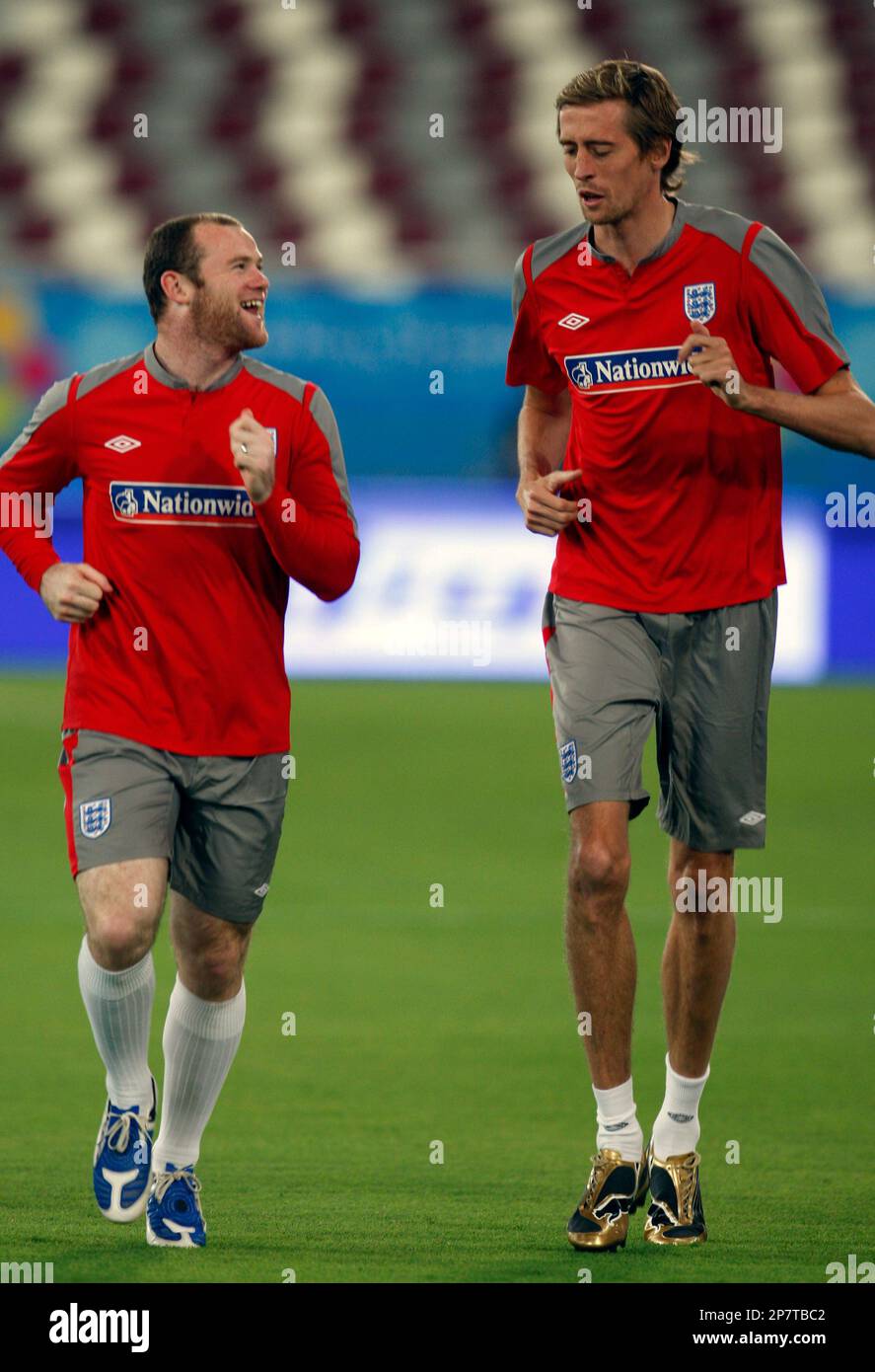 England soccer player Wayne Rooney, left, talks with Peter Crouch