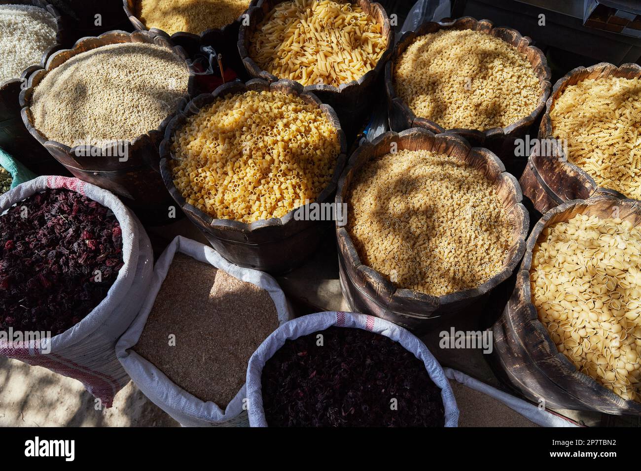 Variety organic groats in barrel on sale on a farmers market