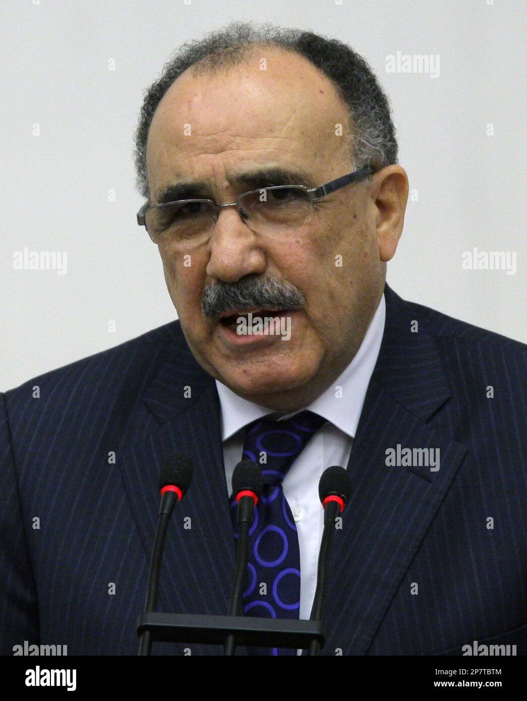 Turkey's Interior Minister Besir Atalay addresses the parliament during a debate on government's "Kurdish initiative" in Ankara, Turkey, Friday, Nov. 13, 2009. Turkish Parliament begun discussing the decades-long issue in a tense atmosphere. (AP Photo/Burhan Ozbilici) Stock Photo