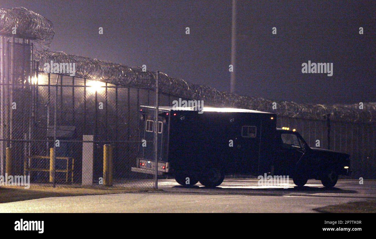 A van carrying the body of convicted sniper John Allen Muhammad leaves