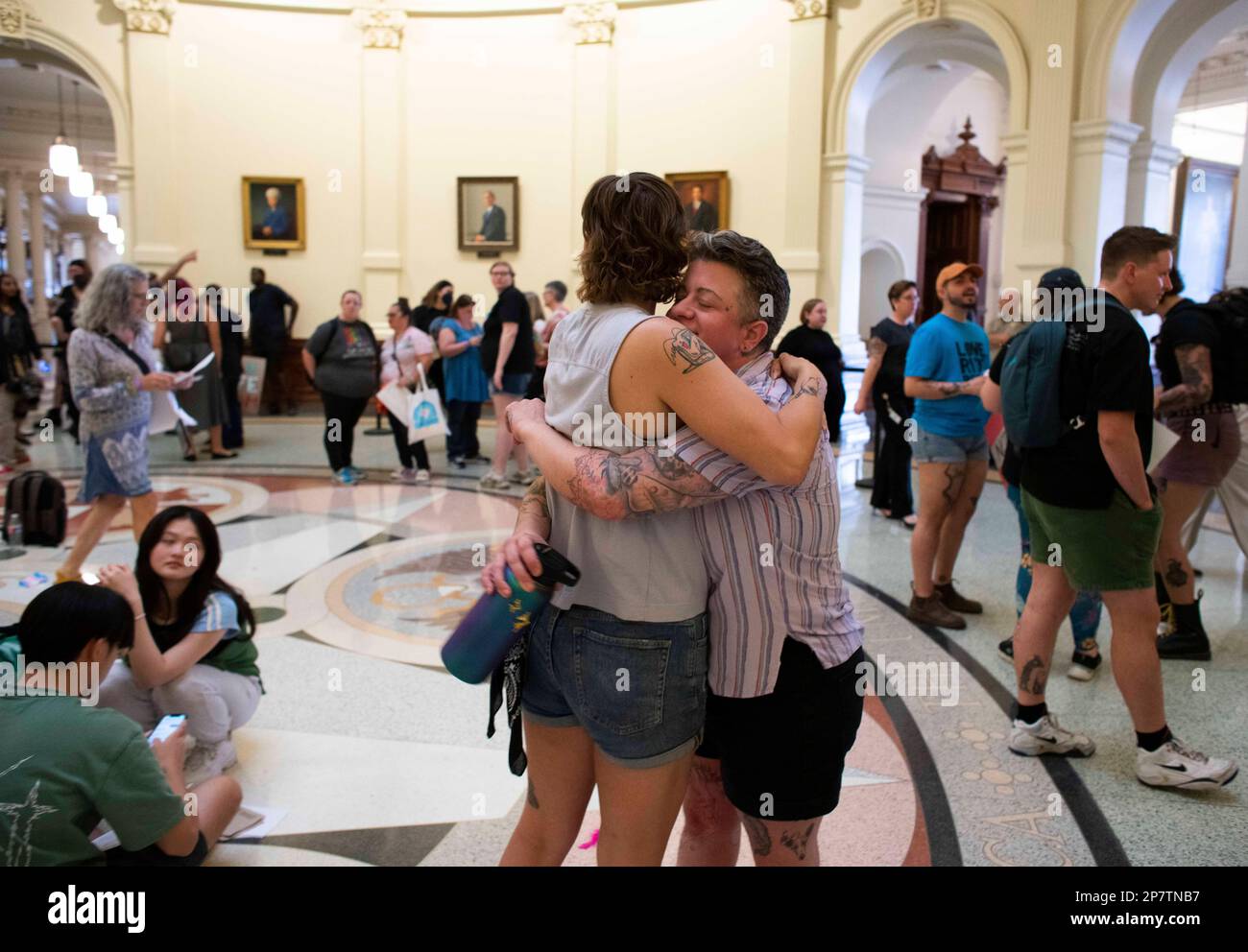 Kendall Jackson (left) and Mac Eggimann (right) of Austin embrace in the rotunda of the Texas Capitol as they attend a rally for transgender rights organized by the Transgender Education Network of Texas (TENT). Dozens of anti-LGBTQ bills have been filed in the House and the Senate. Credit: Bob Daemmrich/Alamy Live News Stock Photo