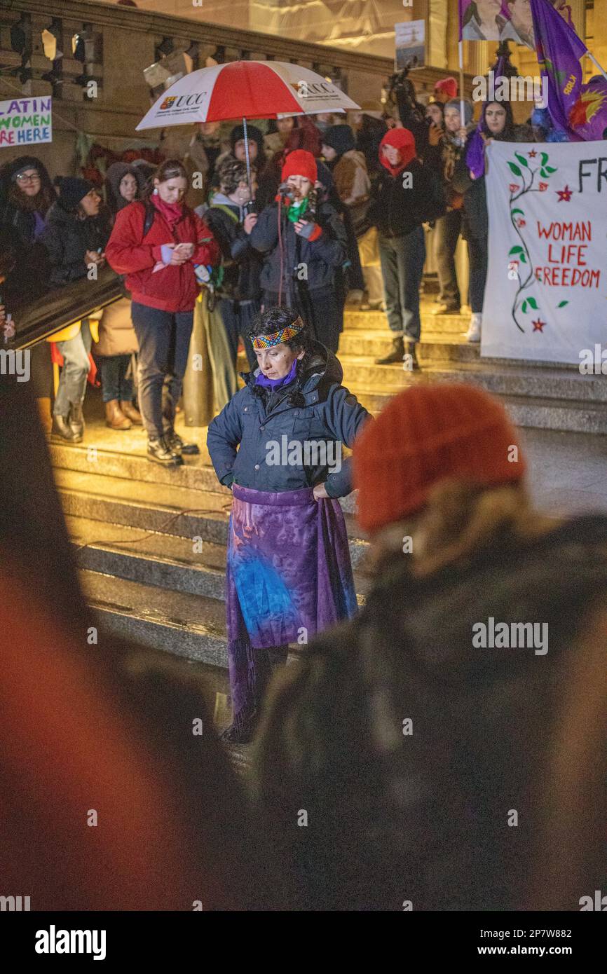 London, UK - 8 March 2023: On a cold and rainy evening, women from various backgrounds, including British, French, Iranian, Turkish, Chinese, Mexican, Afghan, and numerous other nationalities and groups, joined together in Trafalgar Square to mark International Women's Day. Credit: Sinai Noor / Alamy Live News Stock Photo