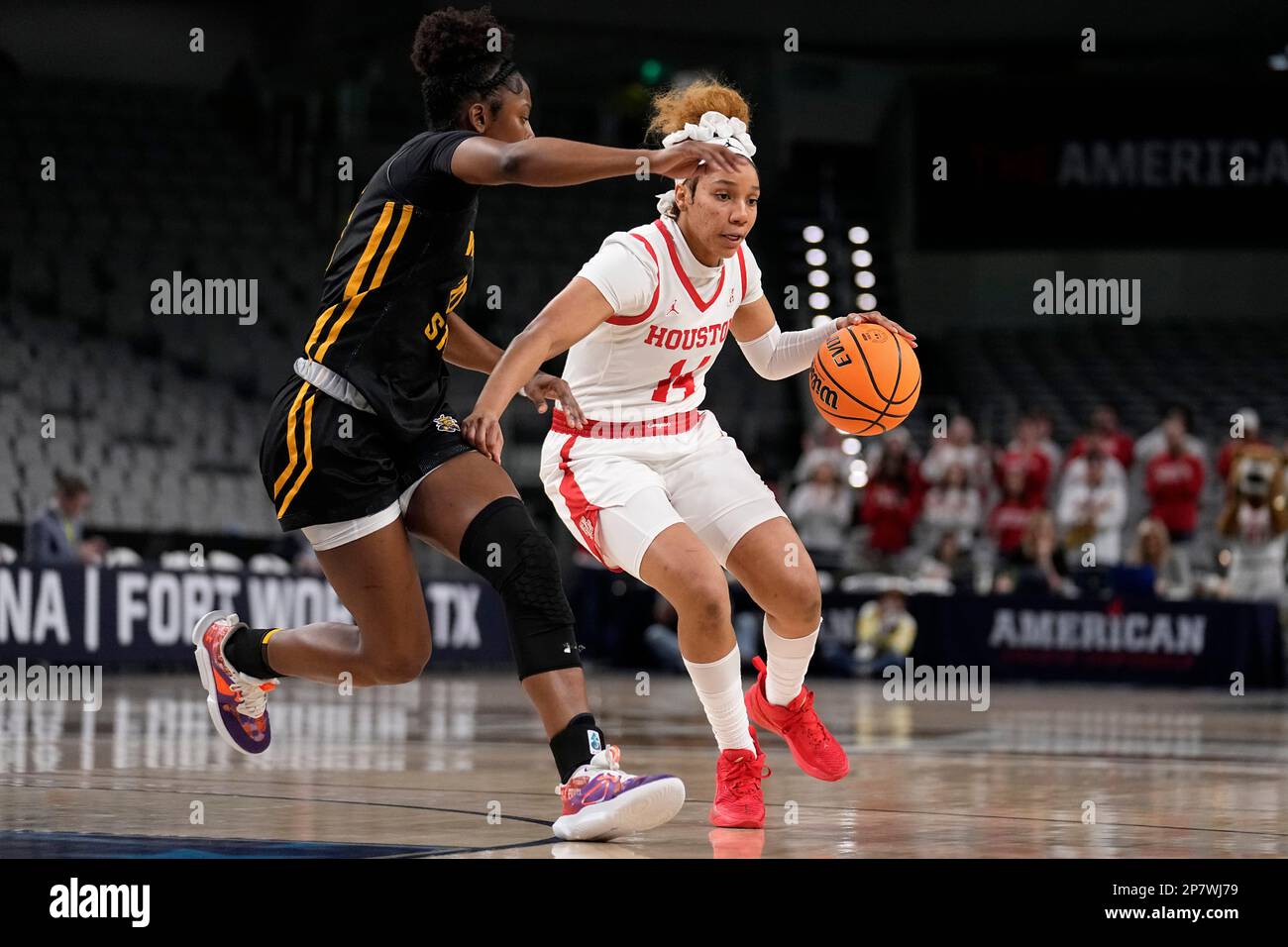 Houston guard Laila Blair (14) works to the basket against Wichita