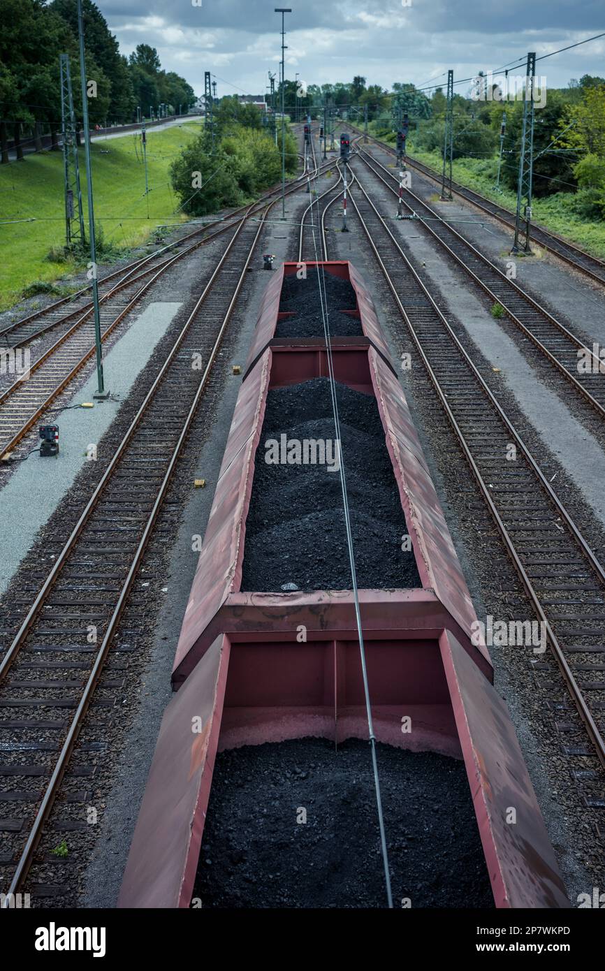 Freight wagons filled with lignite line up at a train station in Nordenham, Germany 2022. Stock Photo
