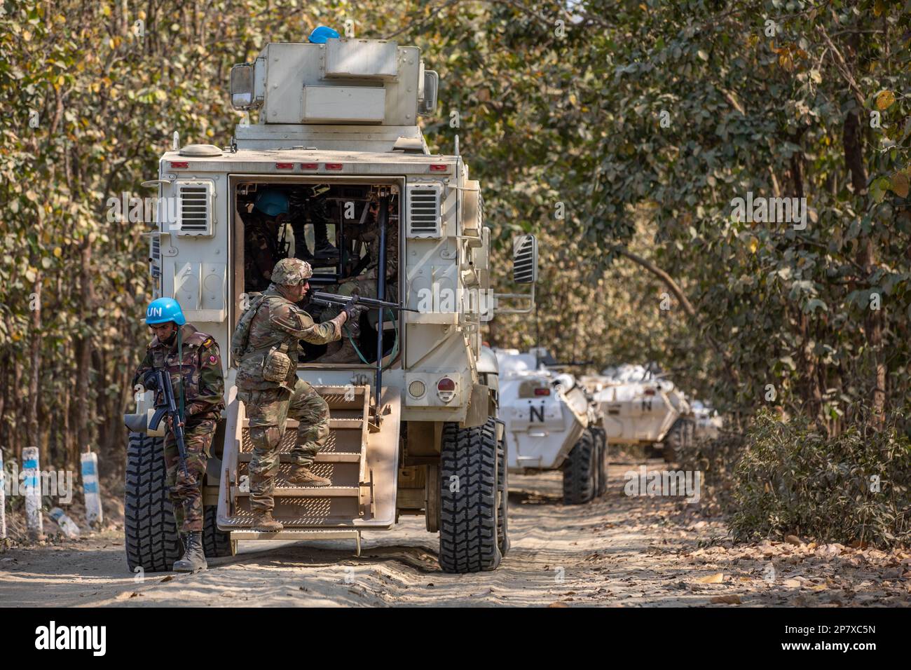 Oregon Army National Guard member of 3-116 Cavalry unit, Charlie Company, dismounts a mine-resistant ambush protected vehicle with Bangladesh military counterpart during counter-improvised explosive device training as part of Exercise Tiger Lightning 2023 at the Bangladesh Institute of Peace Support Operation Training (BIPSOT) center near Dhaka, Bangladesh March 7, 2023. Tiger Lightning 2023, a bilateral exercise sponsored by the U.S. Indo-Pacific Command and hosted by the Bangladesh Armed Forces, works each year to strengthen Bangladesh peacekeeping readiness, promote interoperability, and re Stock Photo