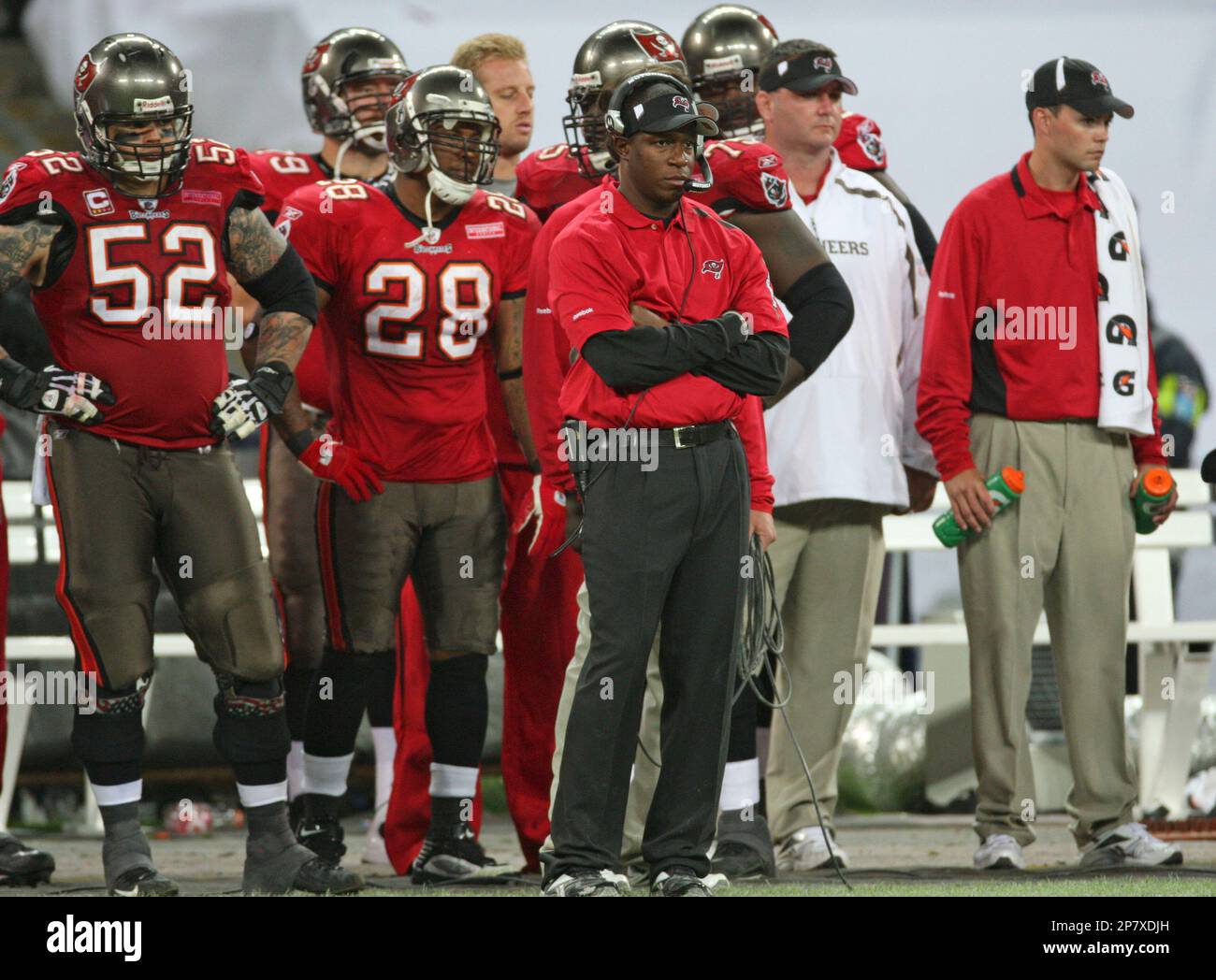 13 SEP 2009: Head Coach Raheem Morris of the Buccaneers in the red shirt  watches the instant replay during the game between the Dallas Cowboys and  the Tampa Bay Buccaneers at Raymond