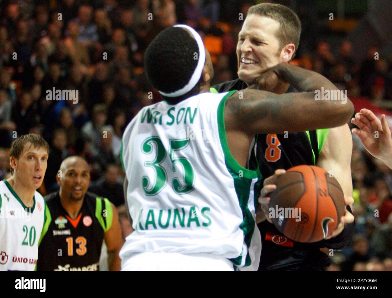 Travis Watson, left, of Lithuanian BC Zalgiris vies for the ball with Curtis Borchardt of French team BC Asvel Villeurbanne during a Euroleague match in Kaunas, Lithuania,Wednesday, Oct. 21, 2009. (AP Photo/Mindaugas Kulbis) Stock Photo