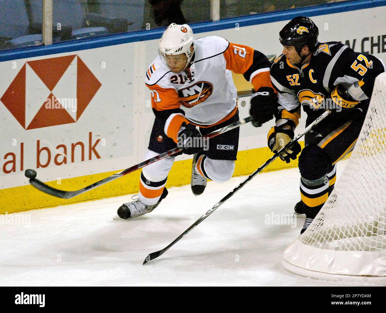 New Yorker Islanders right winger Kyle Okposo, left, tries to control ...