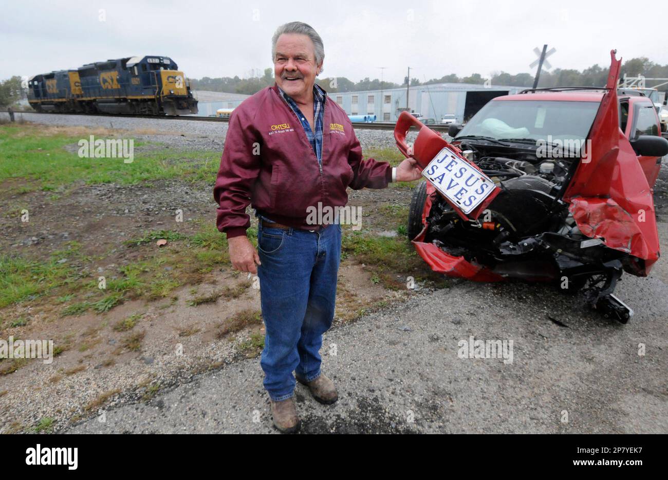 https://c8.alamy.com/comp/2P7YEK7/steve-bumpus-of-hadley-ky-looks-at-the-jesus-saves-license-plate-he-found-25-yards-from-his-suv-after-he-survived-a-collision-with-a-train-friday-oct-16-2009-at-tobacco-road-in-bowling-green-ky-bumpus-who-was-uninjured-said-he-did-not-see-the-train-coming-i-really-was-saved-said-bumpus-of-his-ordealap-photodaily-news-joe-imel-2P7YEK7.jpg